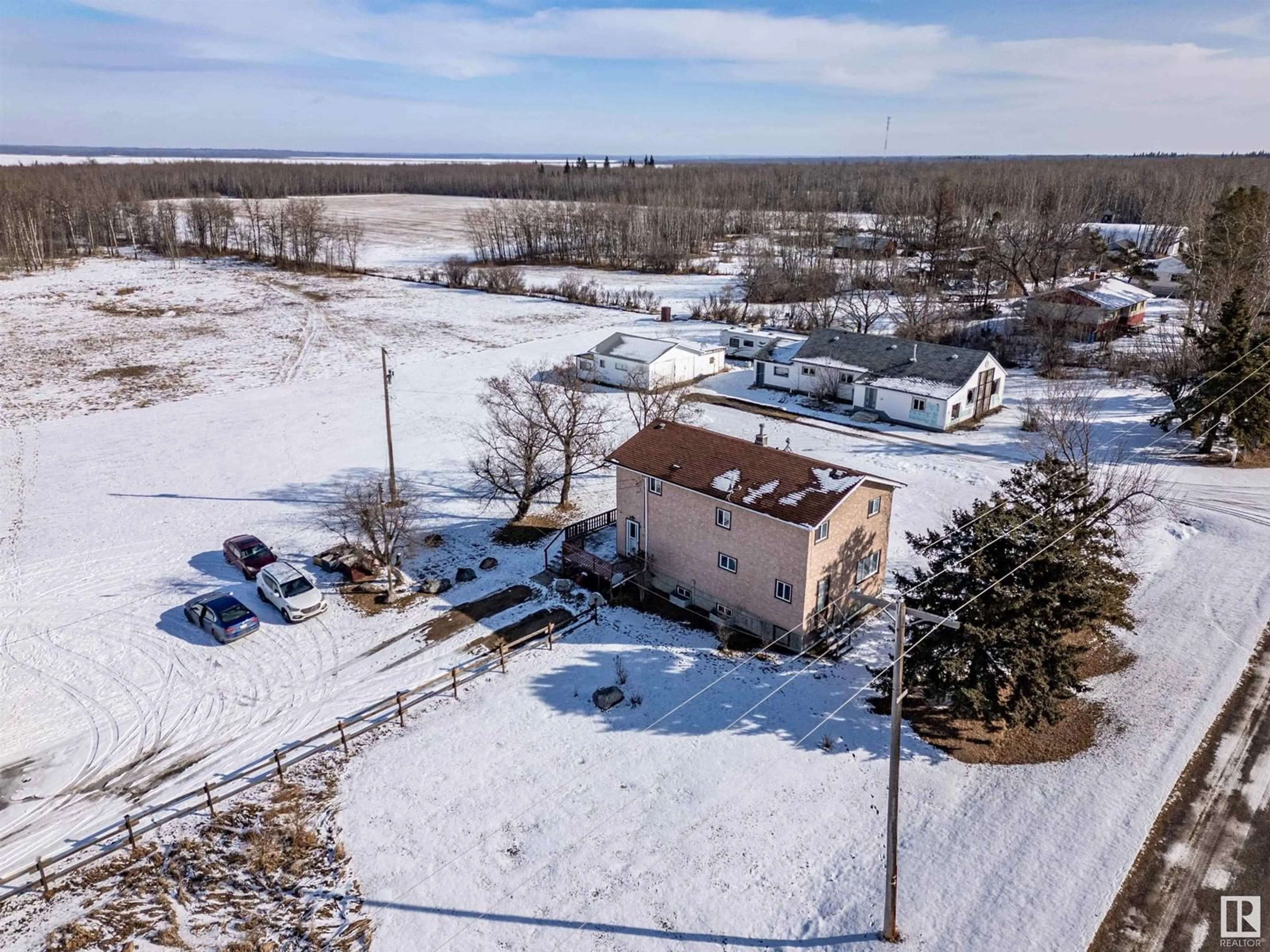 A pic from outside/outdoor area/front of a property/back of a property/a pic from drone, unknown for 21436 HWY 14, Rural Strathcona County Alberta T8E1G9