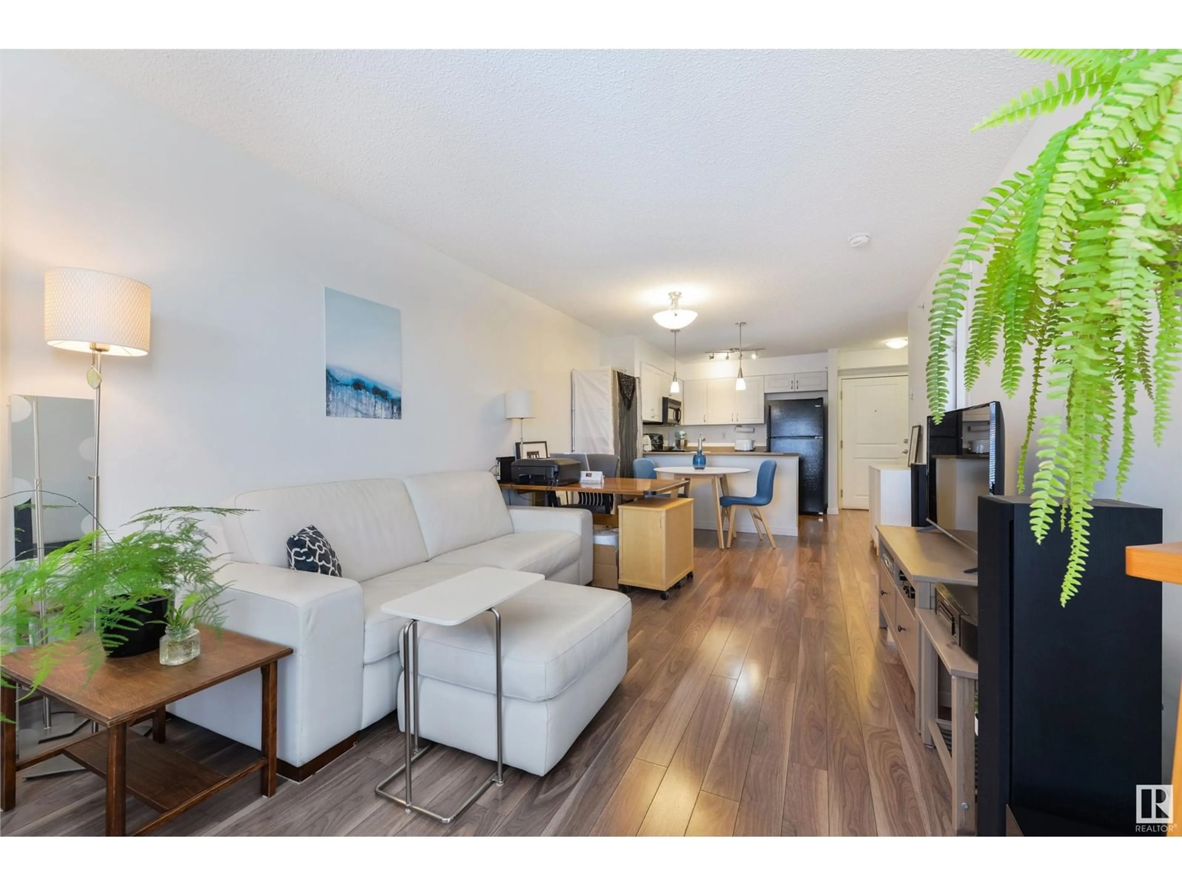 Living room with furniture, wood/laminate floor for #414 11449 ELLERSLIE RD SW, Edmonton Alberta T6W1T2