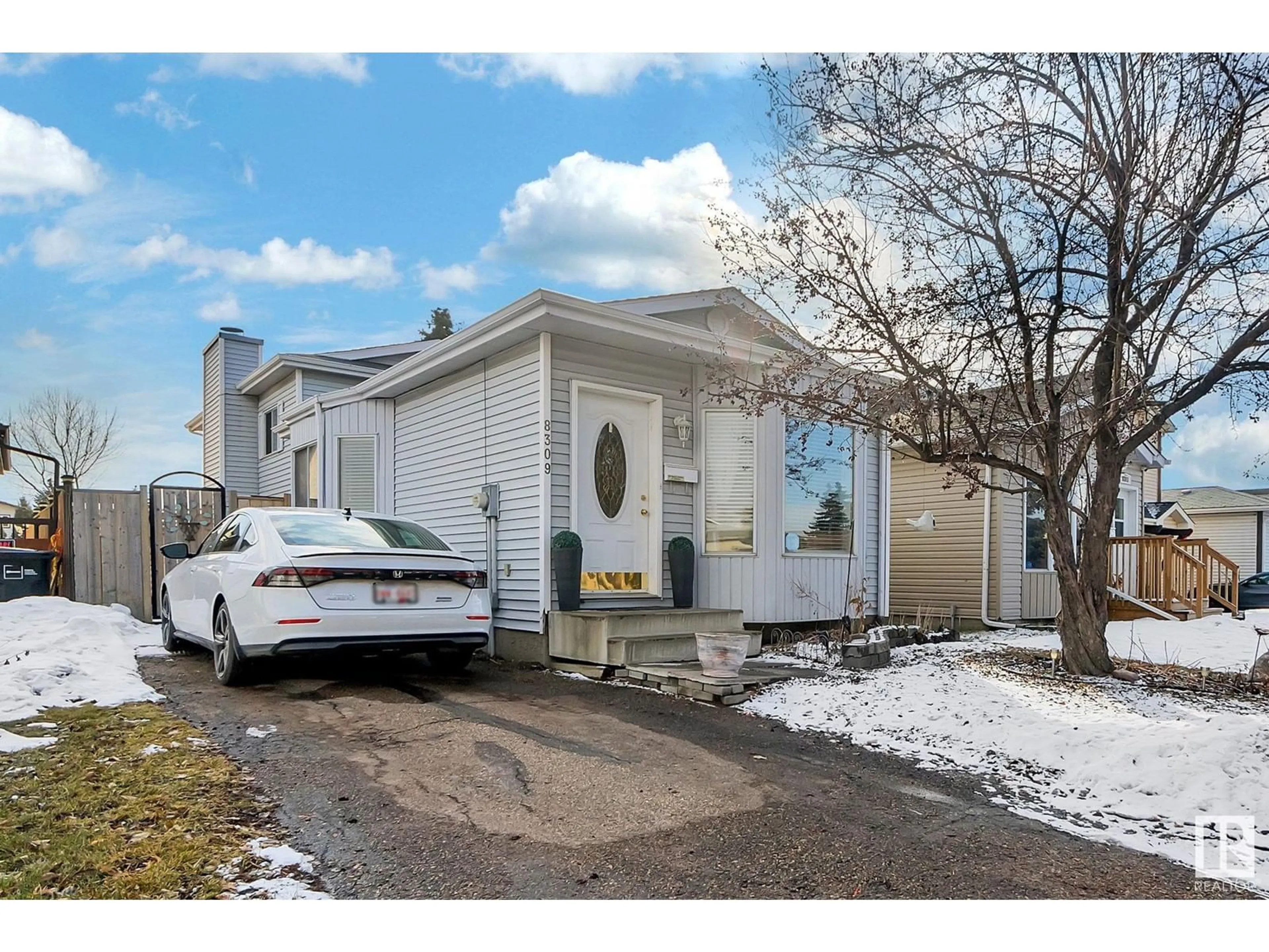 Home with vinyl exterior material, street for 8309 156 AV NW, Edmonton Alberta T5Z2R3