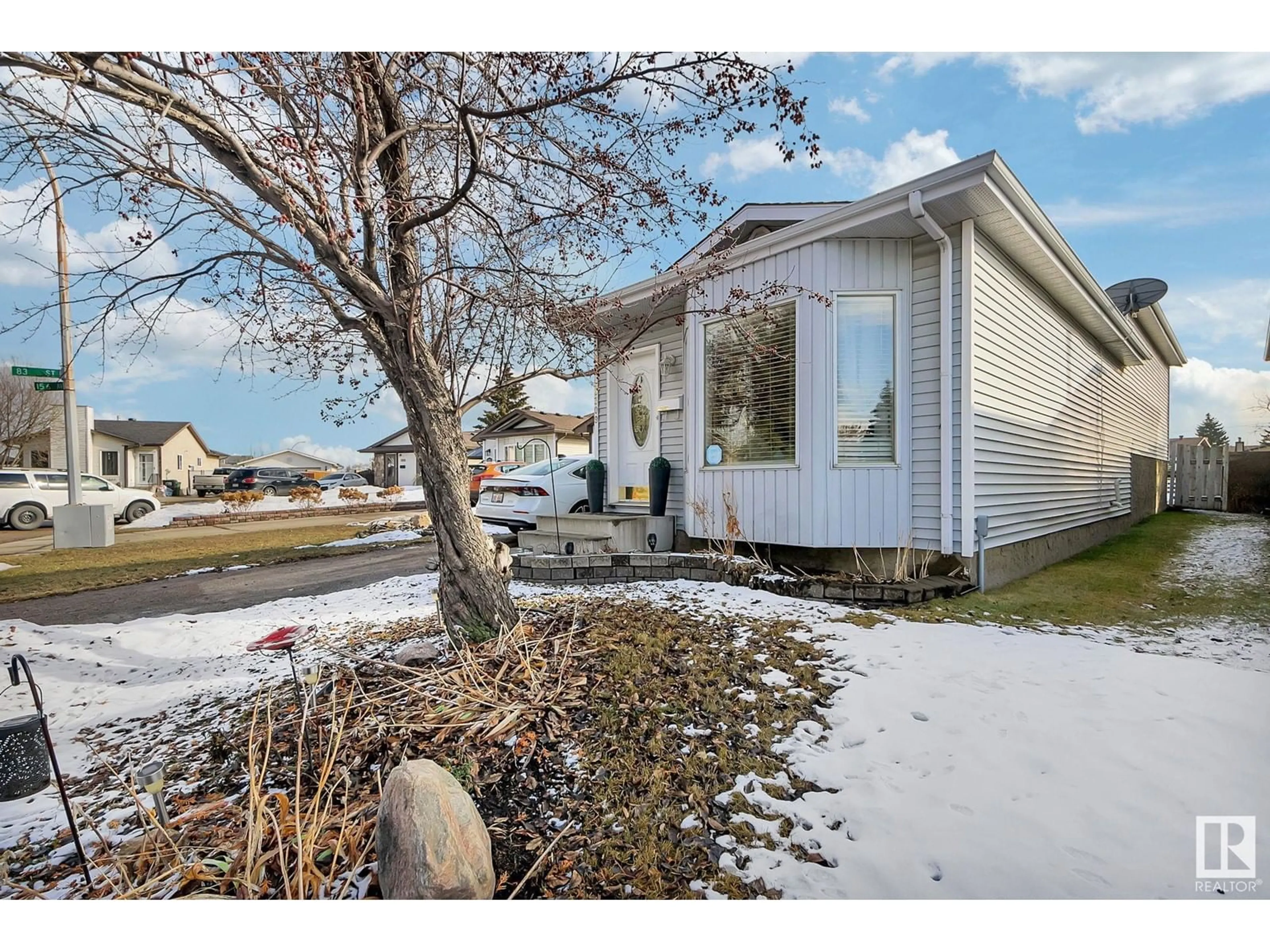 Home with vinyl exterior material, street for 8309 156 AV NW, Edmonton Alberta T5Z2R3