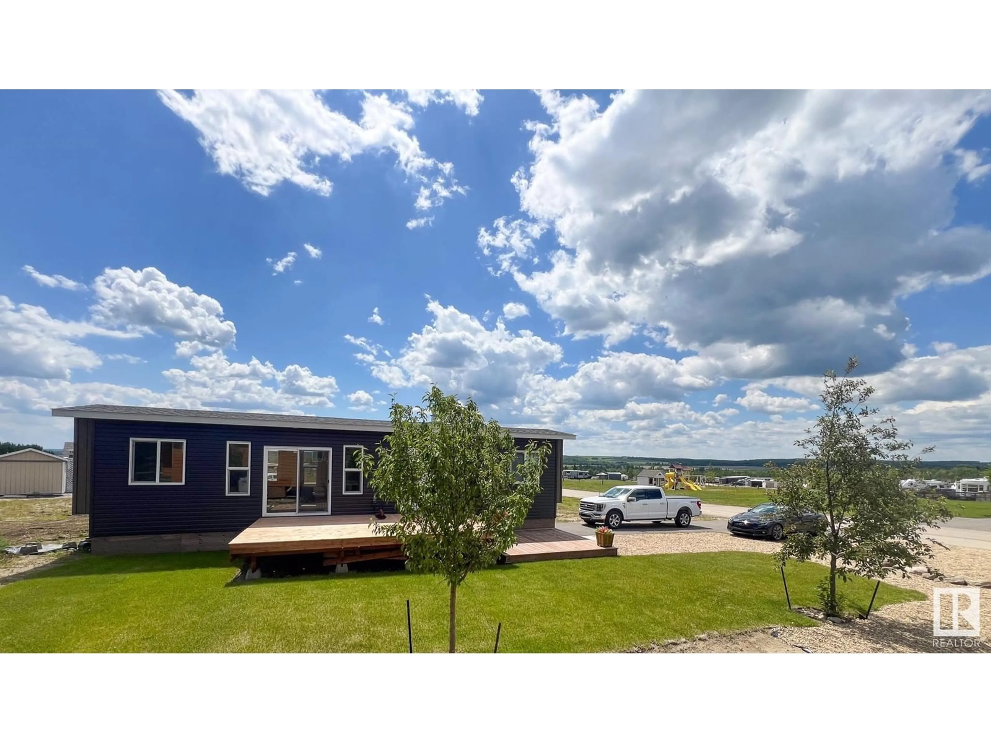 A pic from outside/outdoor area/front of a property/back of a property/a pic from drone, water/lake/river/ocean view for 505 454029 RGE RD 11, Rural Wetaskiwin County Alberta T0C2V0