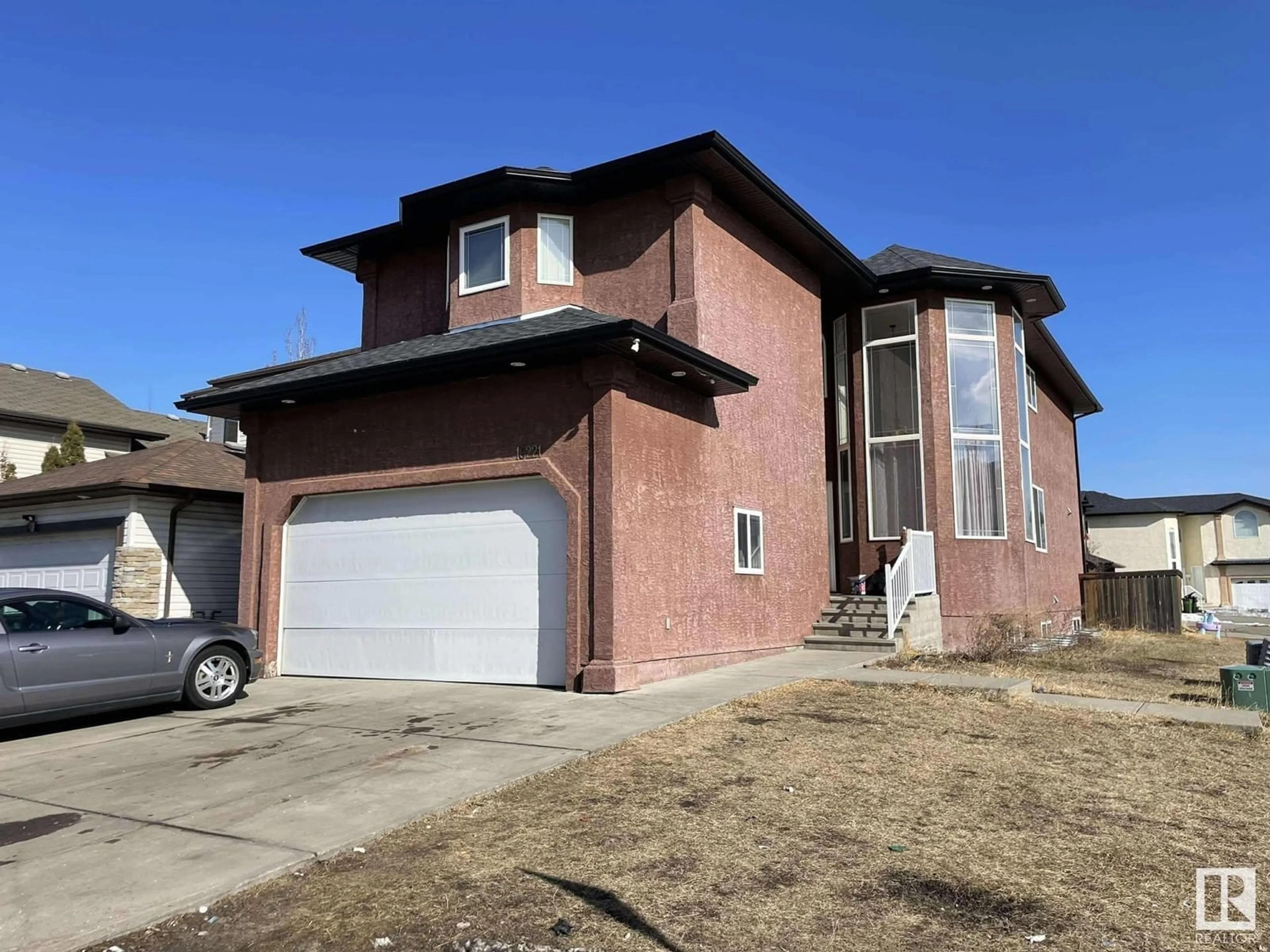 Home with brick exterior material, street for 16221 54A ST NW, Edmonton Alberta T5Y0E9