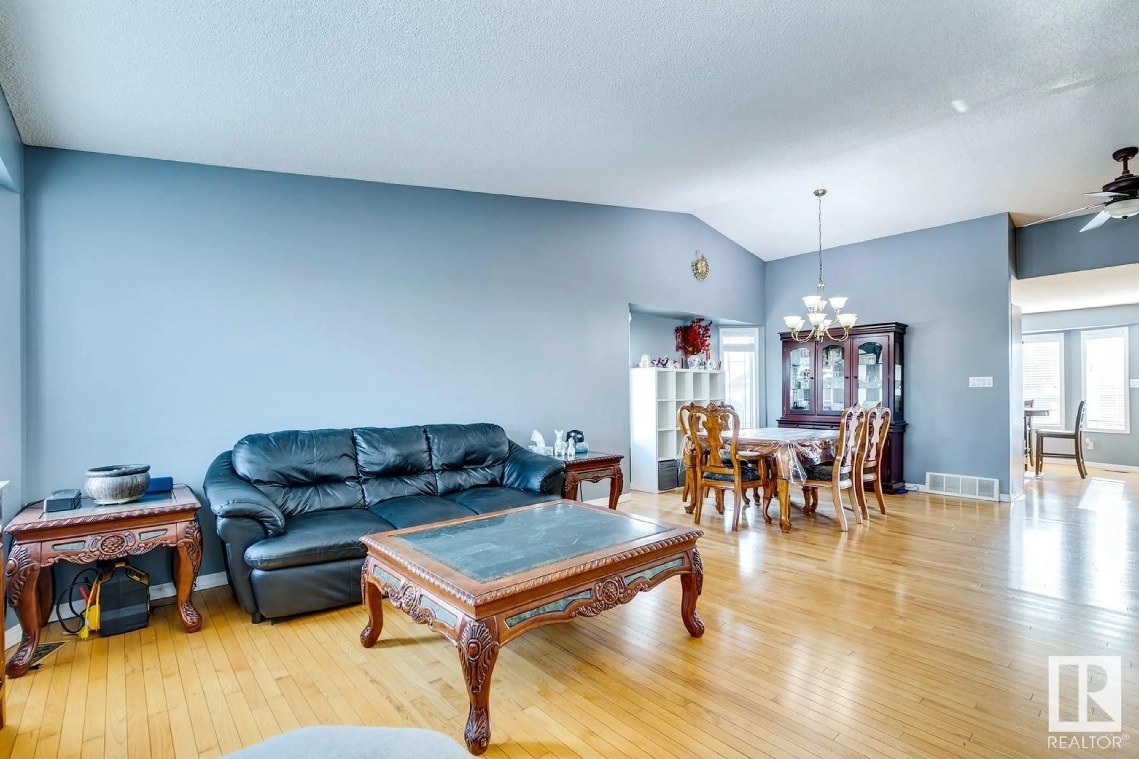 Living room with furniture, wood/laminate floor for 171 KLARVATTEN RD NW, Edmonton Alberta T5Z2X3