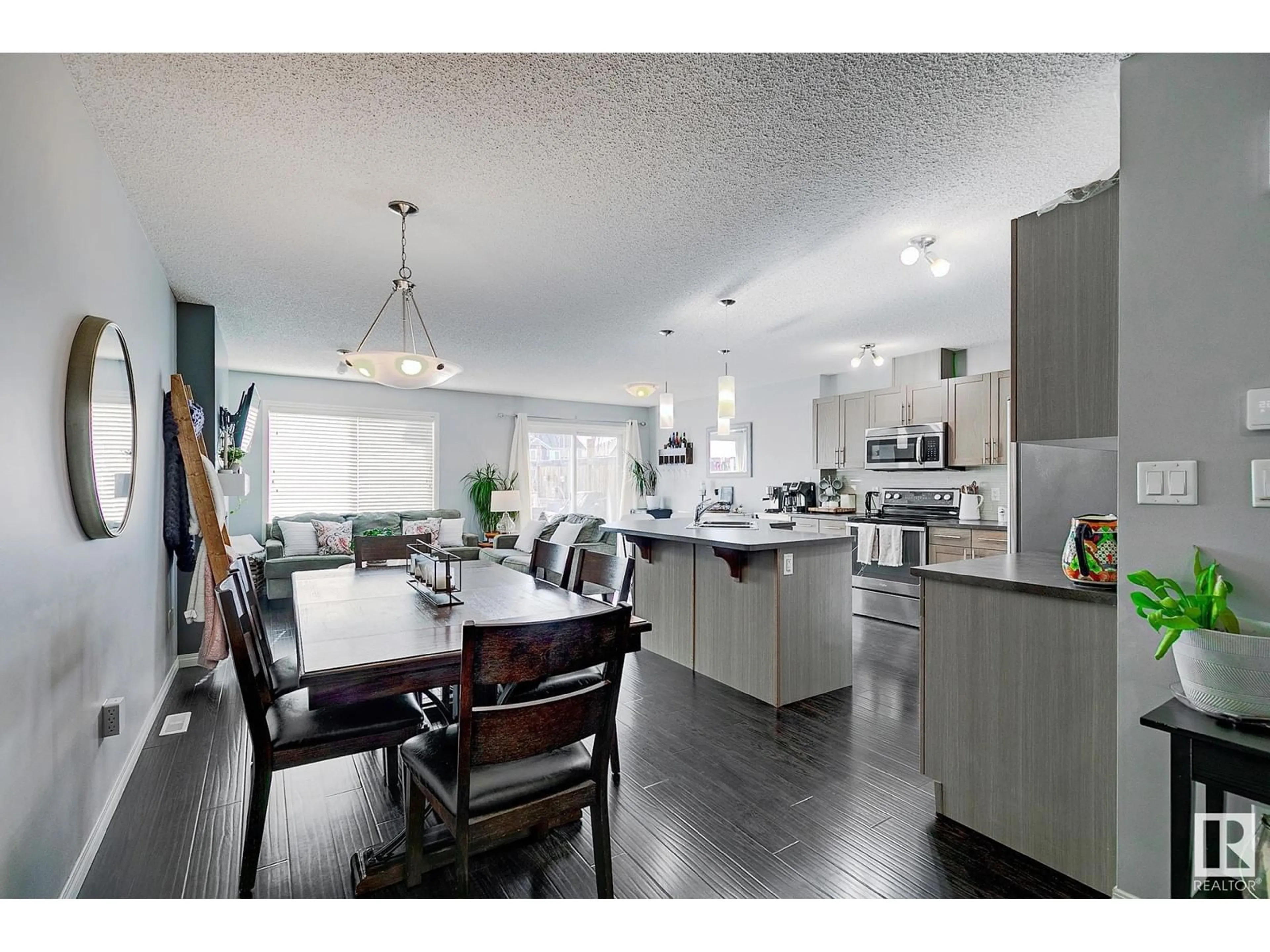 Open concept kitchen, wood/laminate floor for 7315 24 AV SW, Edmonton Alberta T6X0V5