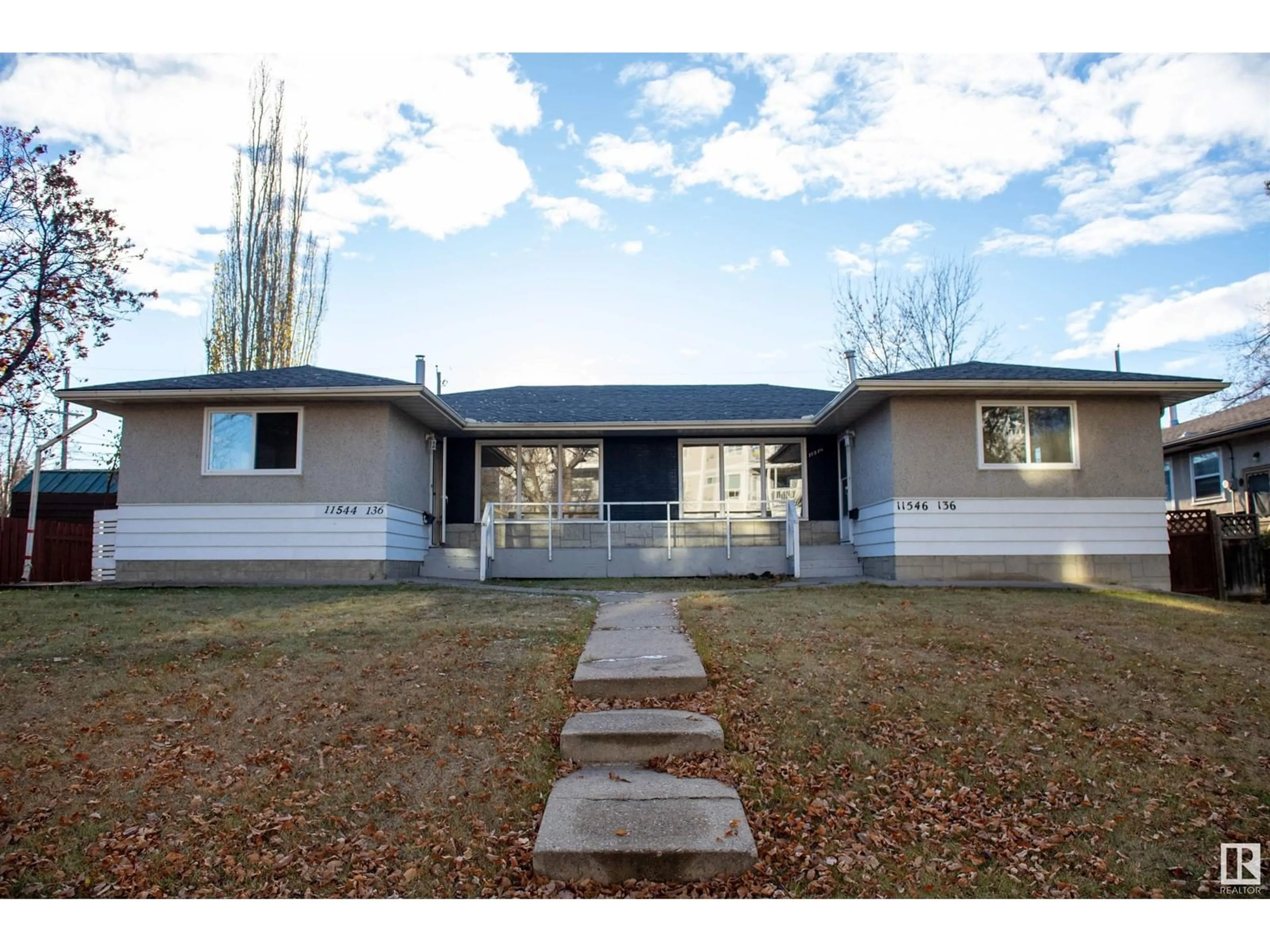 Home with vinyl exterior material, street for 11544 and 11546 136 ST NW, Edmonton Alberta T5M1M3