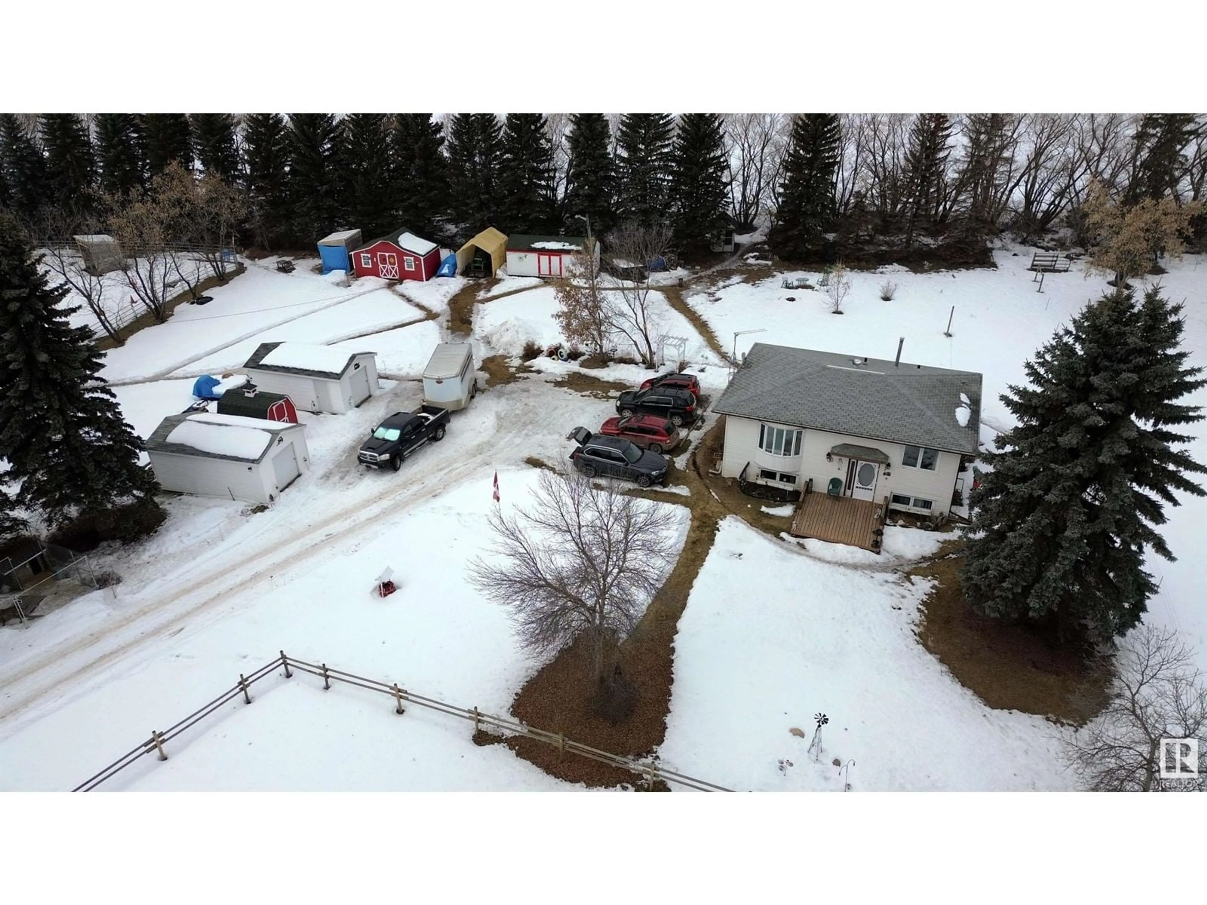 A pic from outside/outdoor area/front of a property/back of a property/a pic from drone, street for 61504 RR 261, Rural Westlock County Alberta T7P2N9