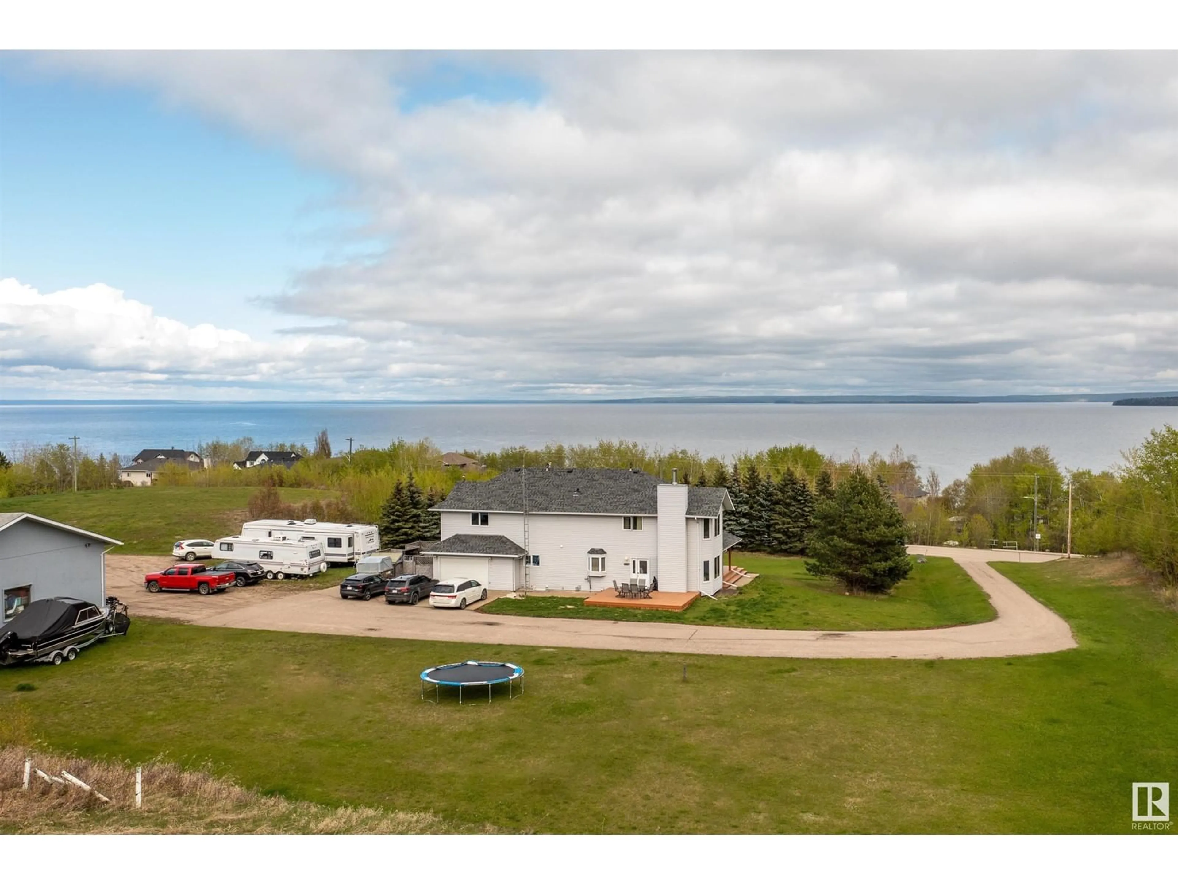 A pic from outside/outdoor area/front of a property/back of a property/a pic from drone, water/lake/river/ocean view for 1301 28 ST, Cold Lake Alberta T9M1G2