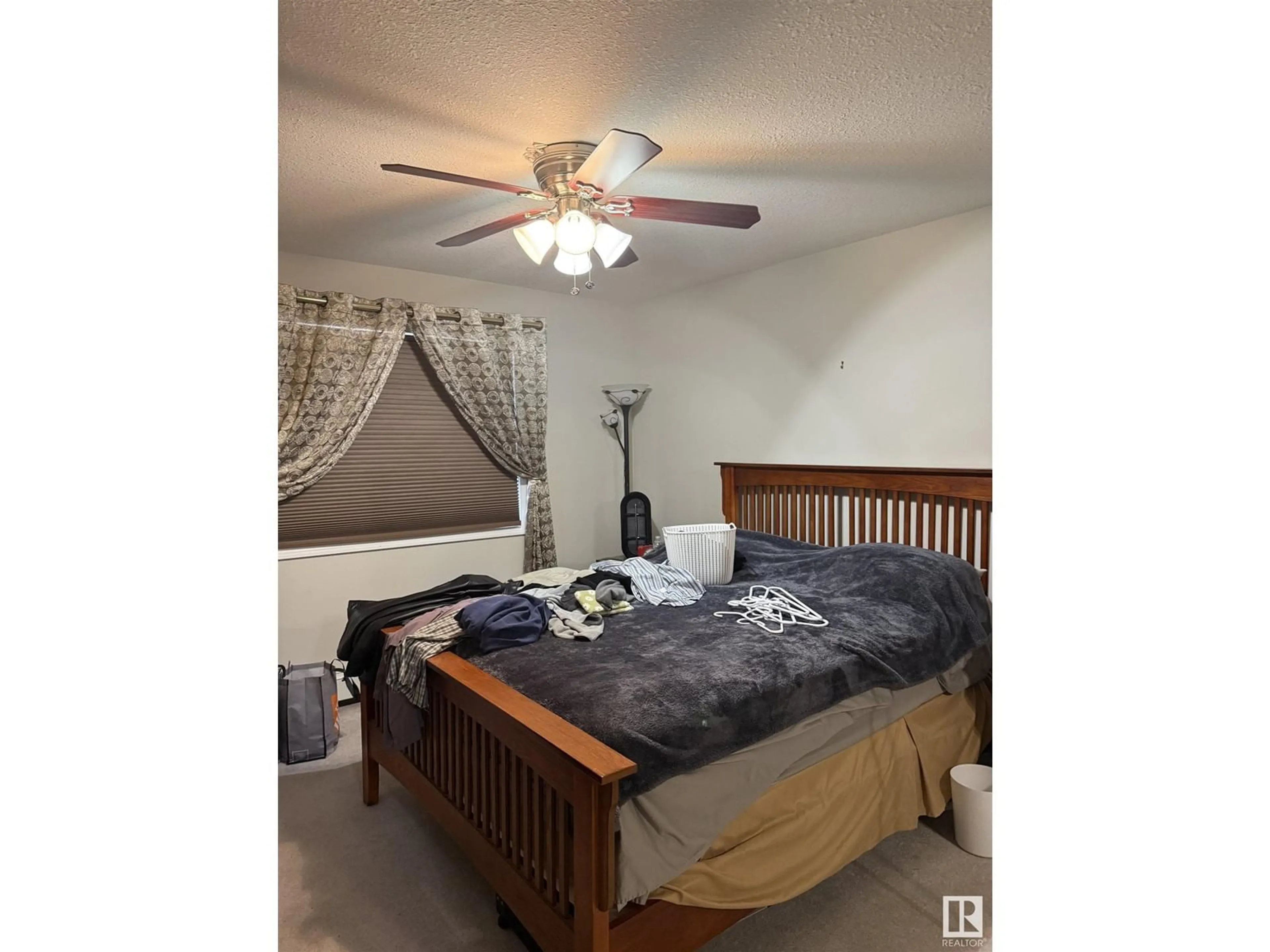 Bedroom with bed, wood/laminate floor for #401 592 HOOKE RD NW, Edmonton Alberta T5A5H2