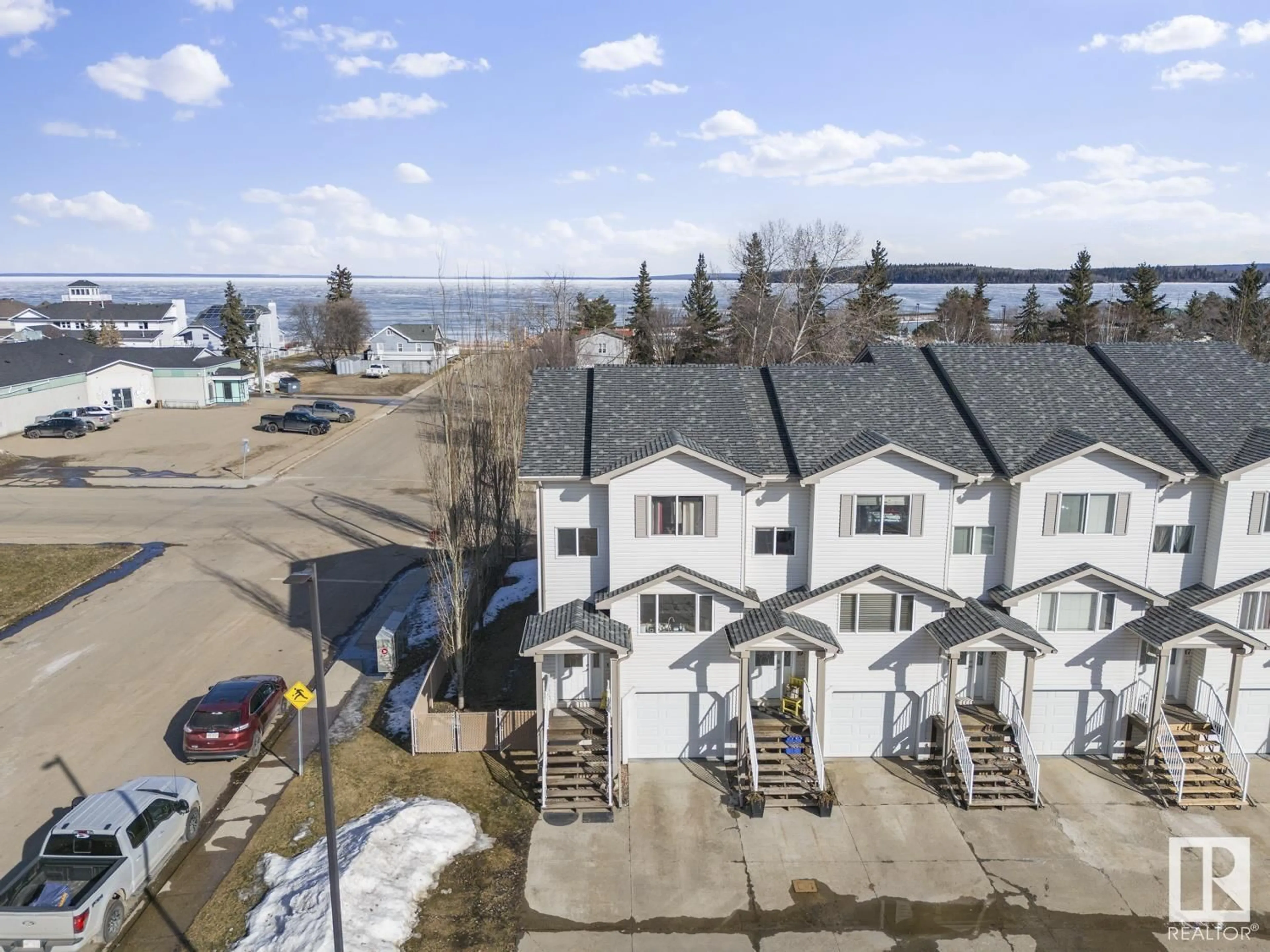 A pic from outside/outdoor area/front of a property/back of a property/a pic from drone, water/lake/river/ocean view for #20 1001 7 AV, Cold Lake Alberta T9M0C4