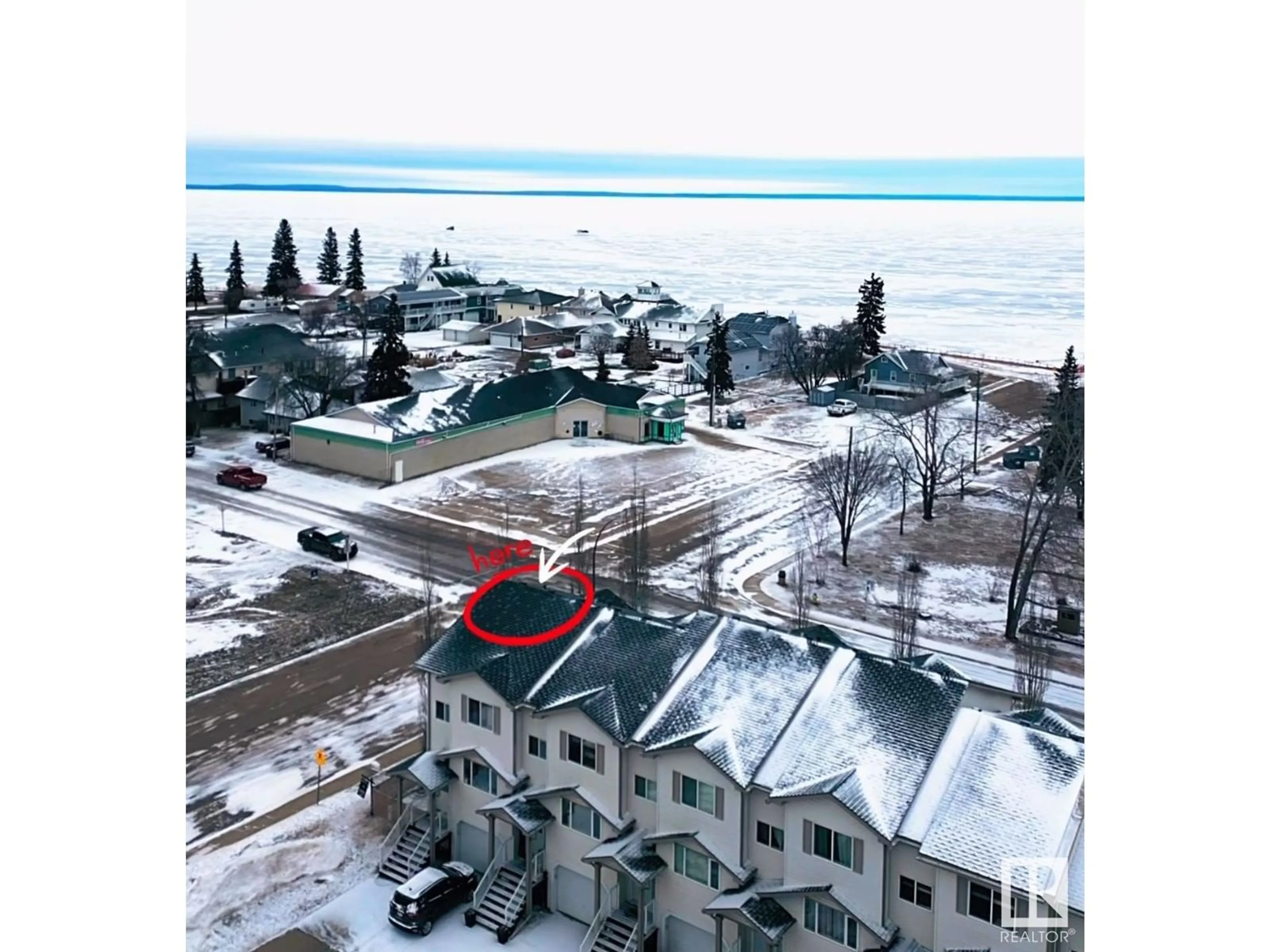 A pic from outside/outdoor area/front of a property/back of a property/a pic from drone, water/lake/river/ocean view for #20 1001 7 AV, Cold Lake Alberta T9M0C4