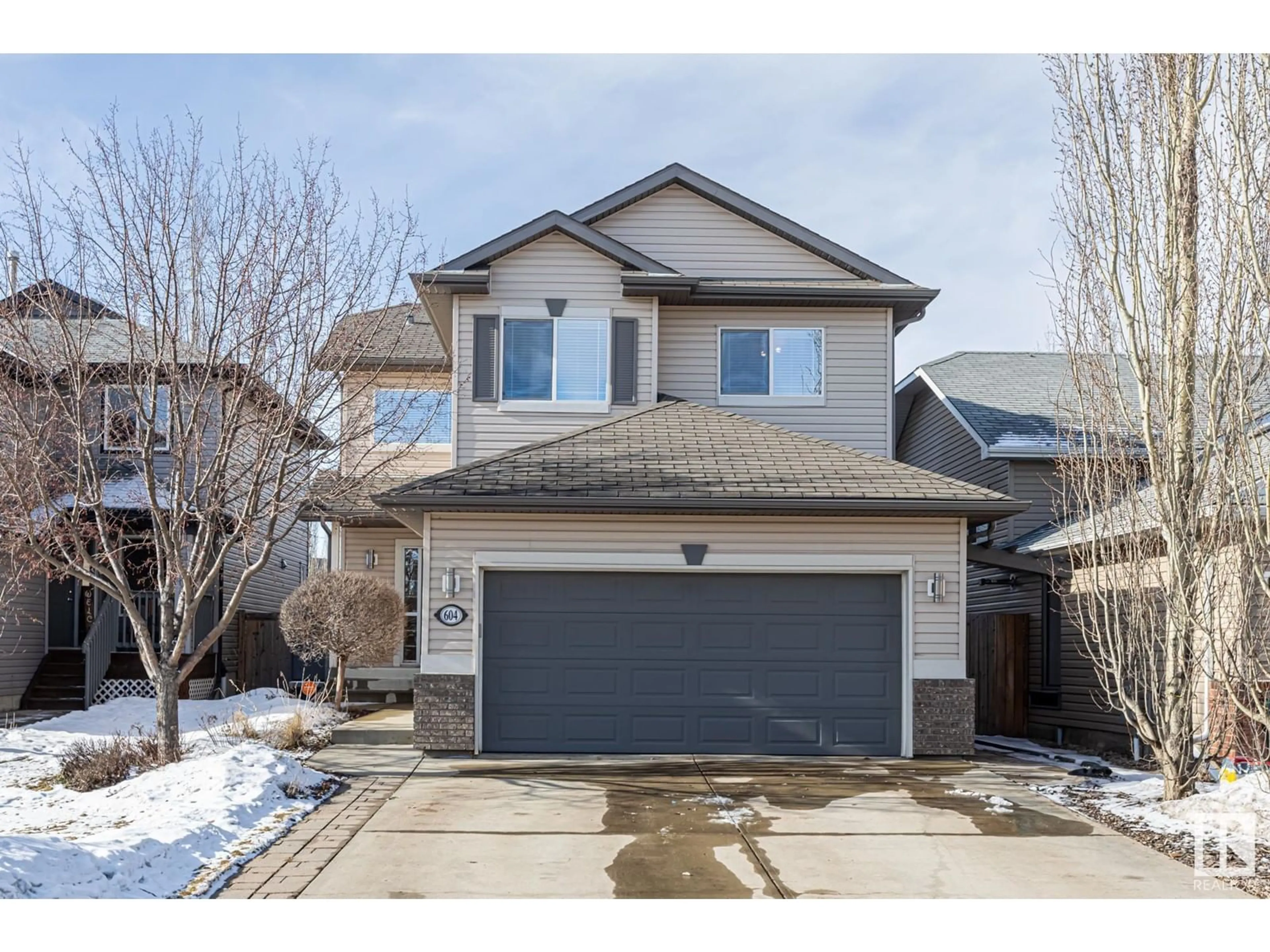 Home with vinyl exterior material, street for 604 Foxtail Lane, Sherwood Park Alberta T8A3C2