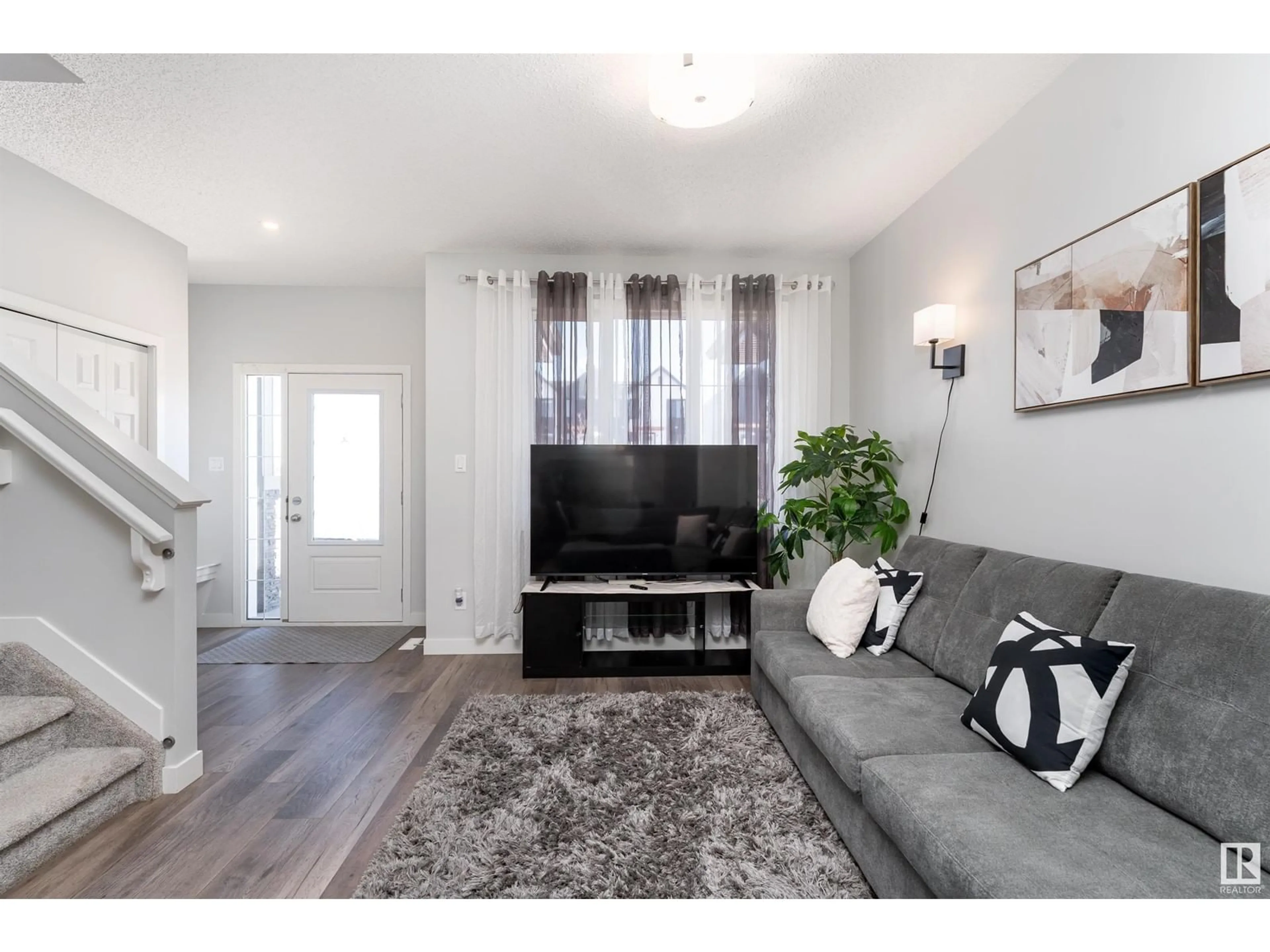 Living room with furniture, wood/laminate floor for 89 COPPERHAVEN DR, Spruce Grove Alberta T7X2X7