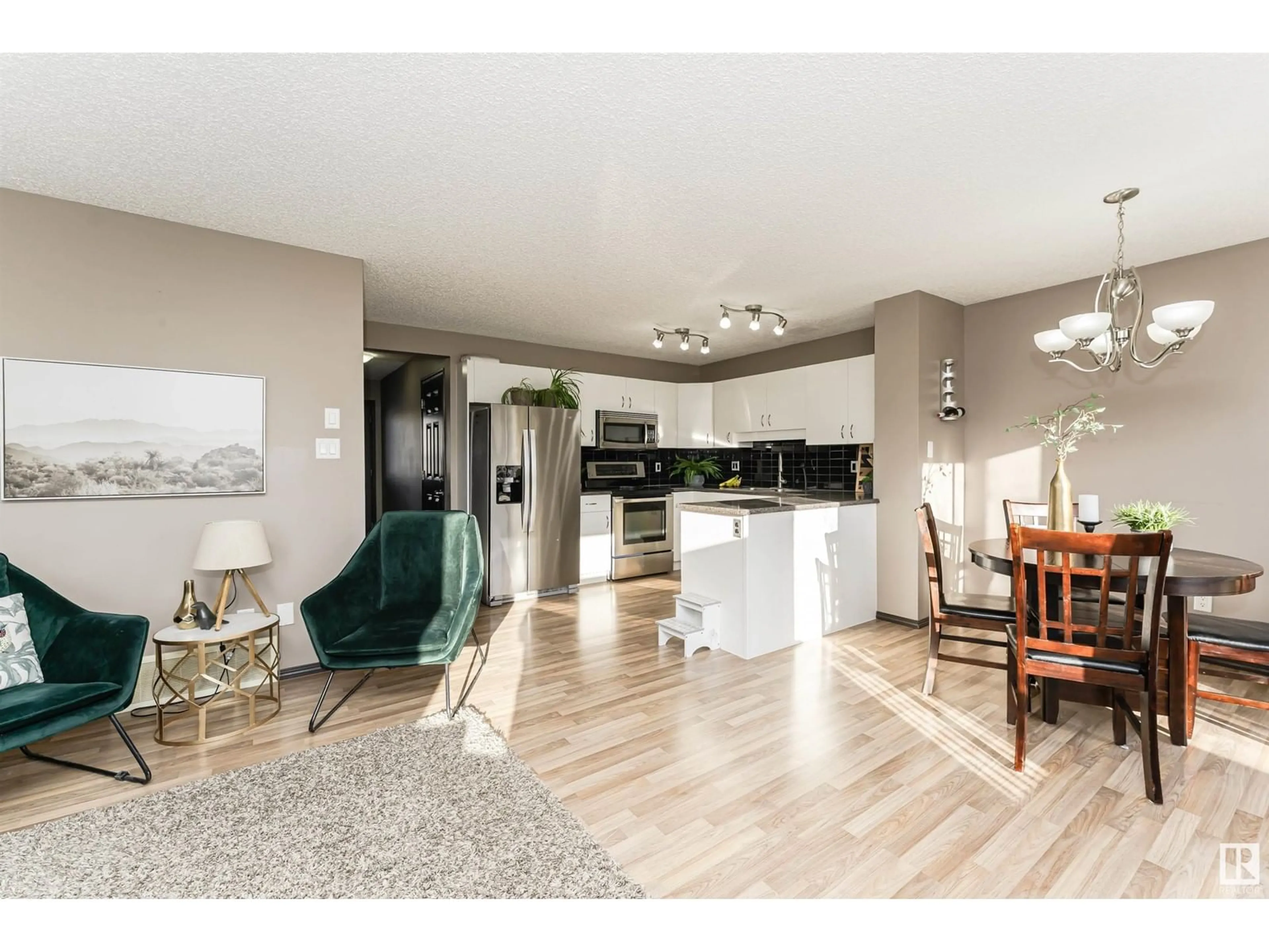 Open concept kitchen, wood/laminate floor for #5 6304 SANDIN WY NW, Edmonton Alberta T6R0J8