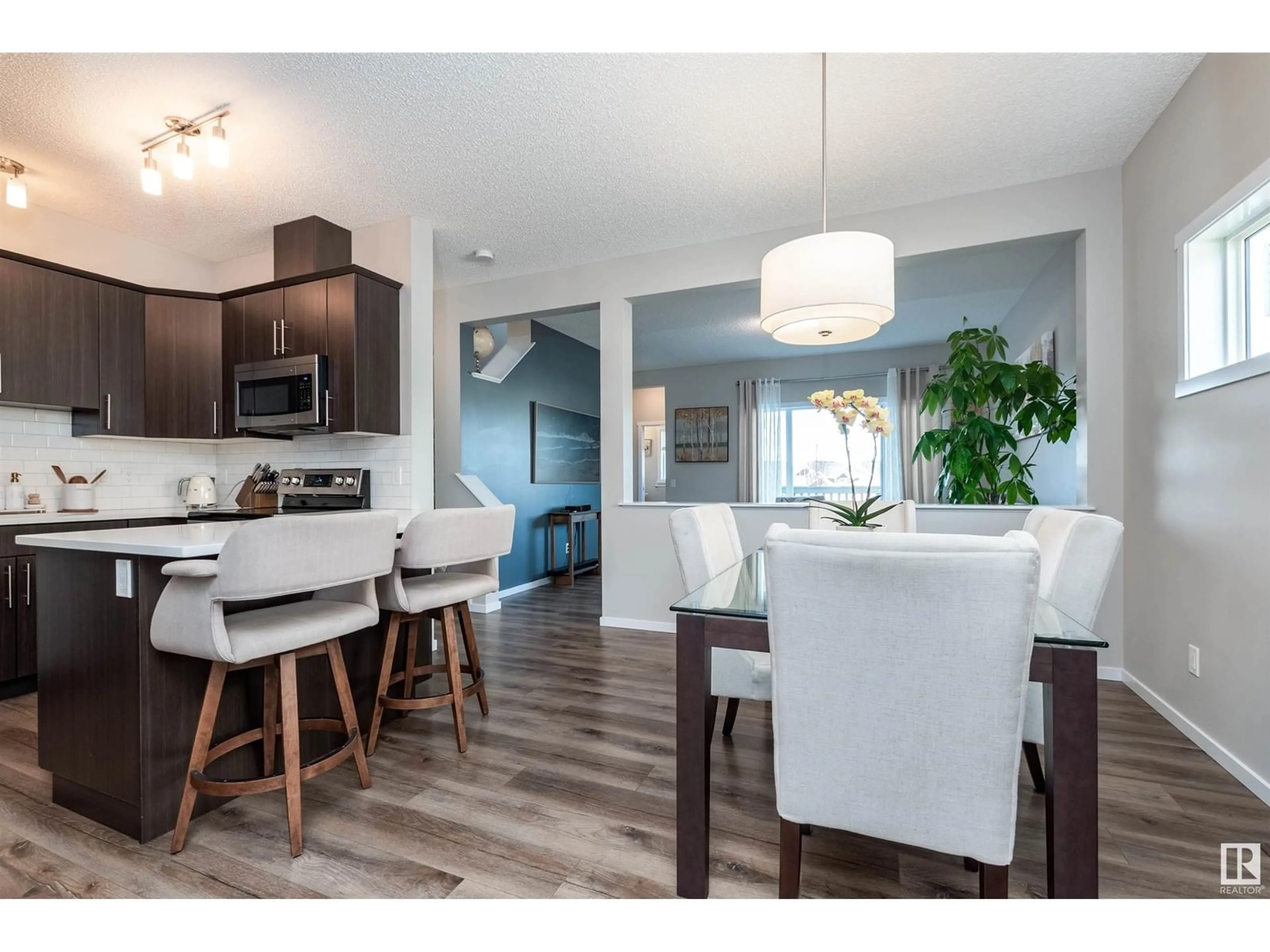 Open concept kitchen, wood/laminate floor for 39 AVEBURY CO, Sherwood Park Alberta T8H0Z3