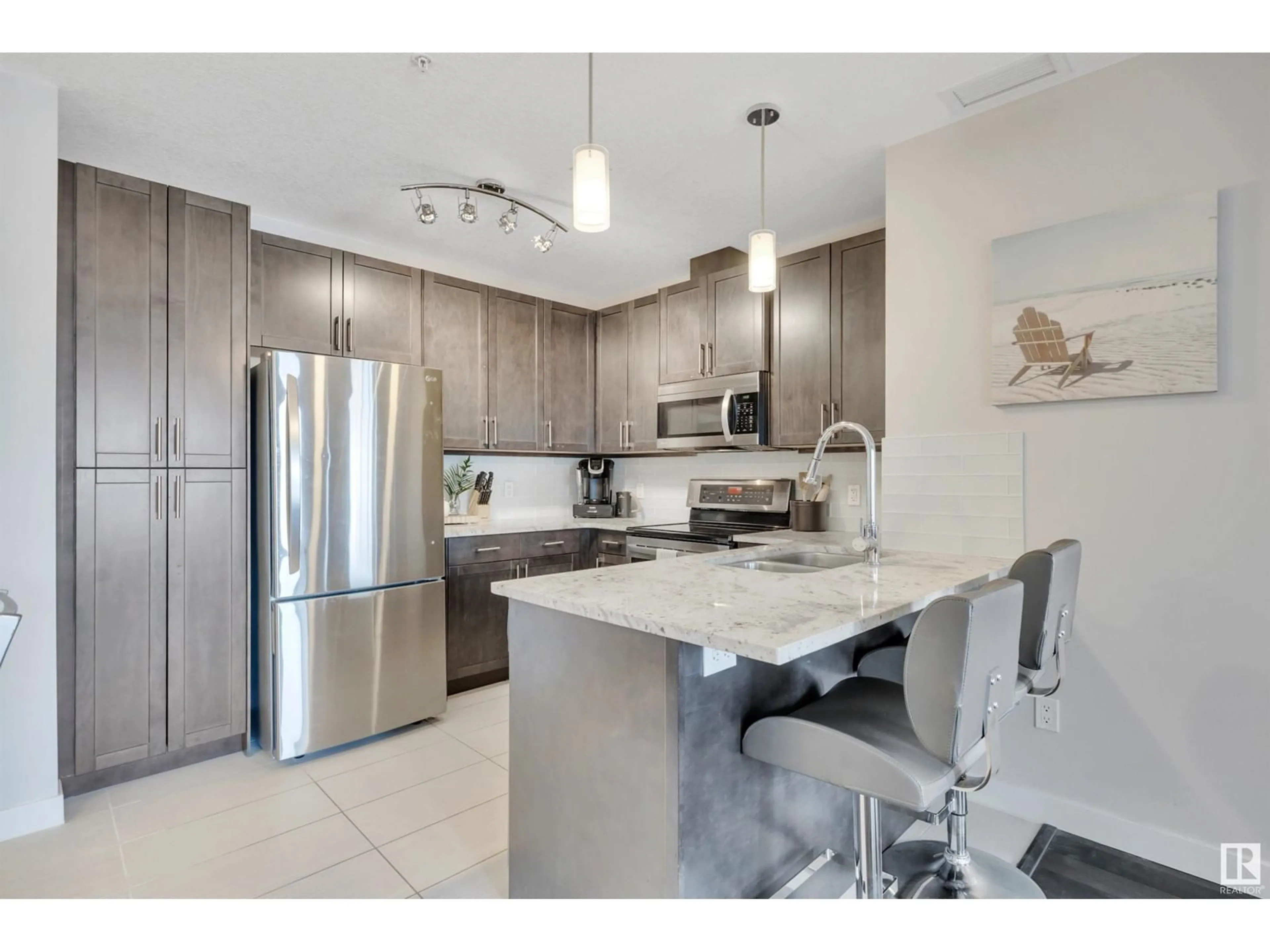 Open concept kitchen, ceramic/tile floor for #214 5151 WINDERMERE BV SW, Edmonton Alberta T6W2K4