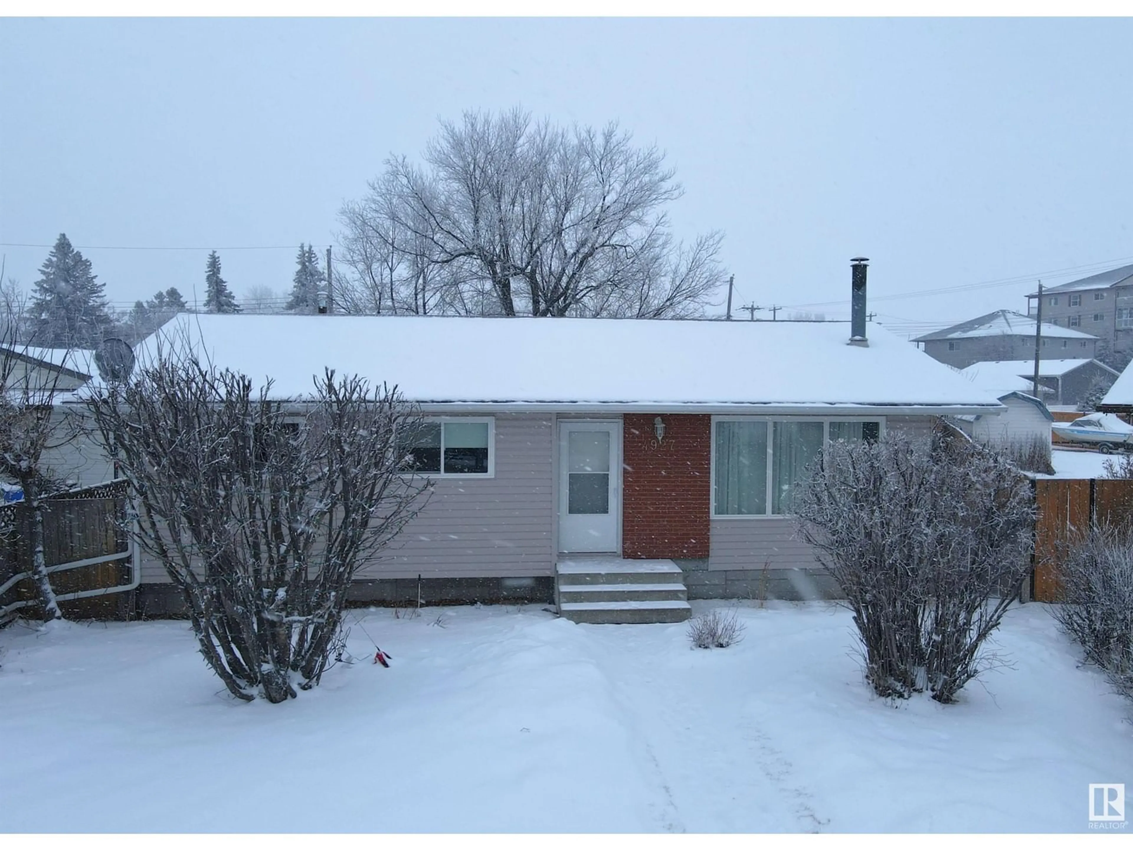 A pic from outside/outdoor area/front of a property/back of a property/a pic from drone, street for 4927 54A AV, Drayton Valley Alberta T7A1A3