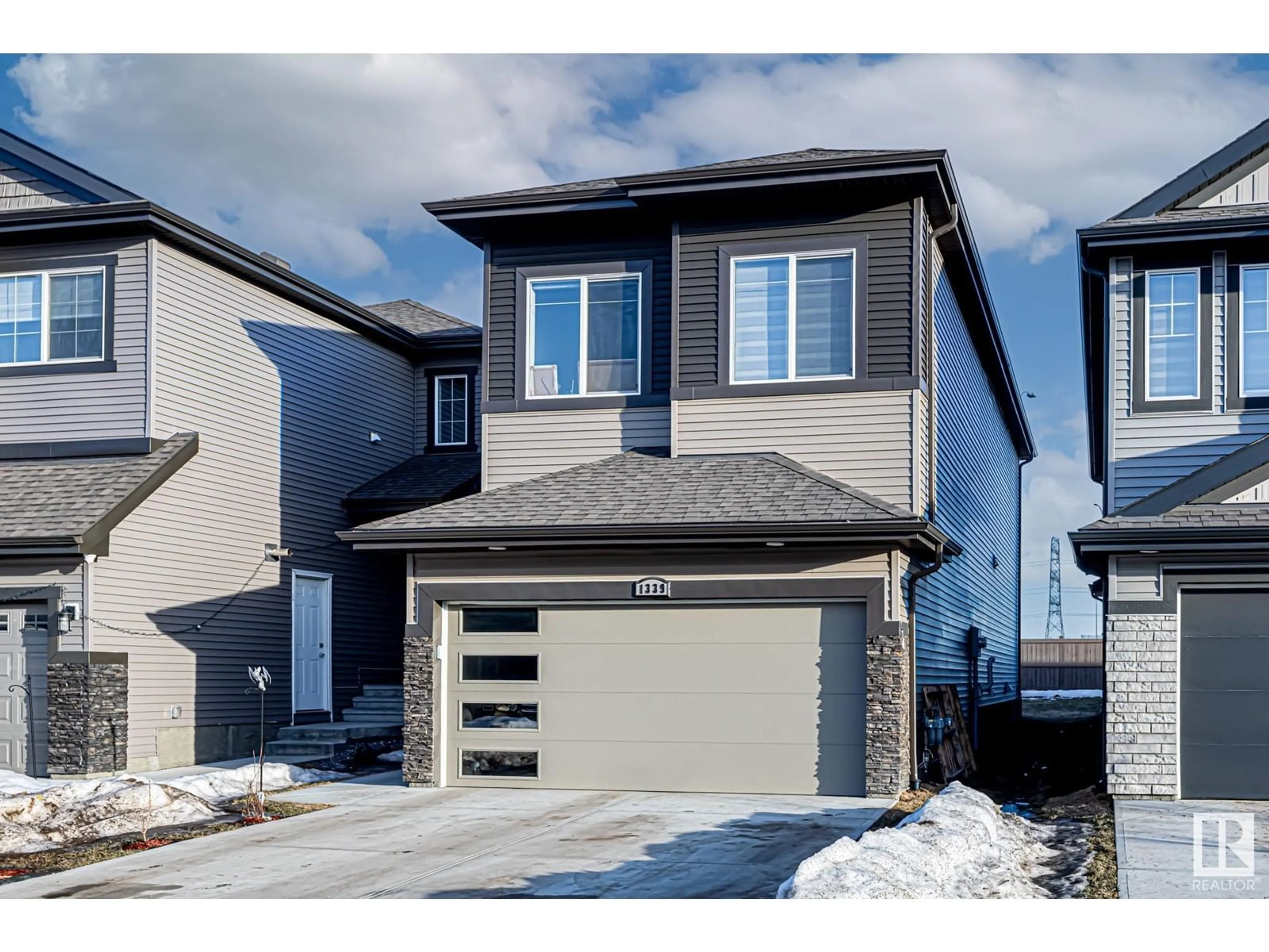 Home with vinyl exterior material, street for 1339 20 ST NW, Edmonton Alberta T6T2R7