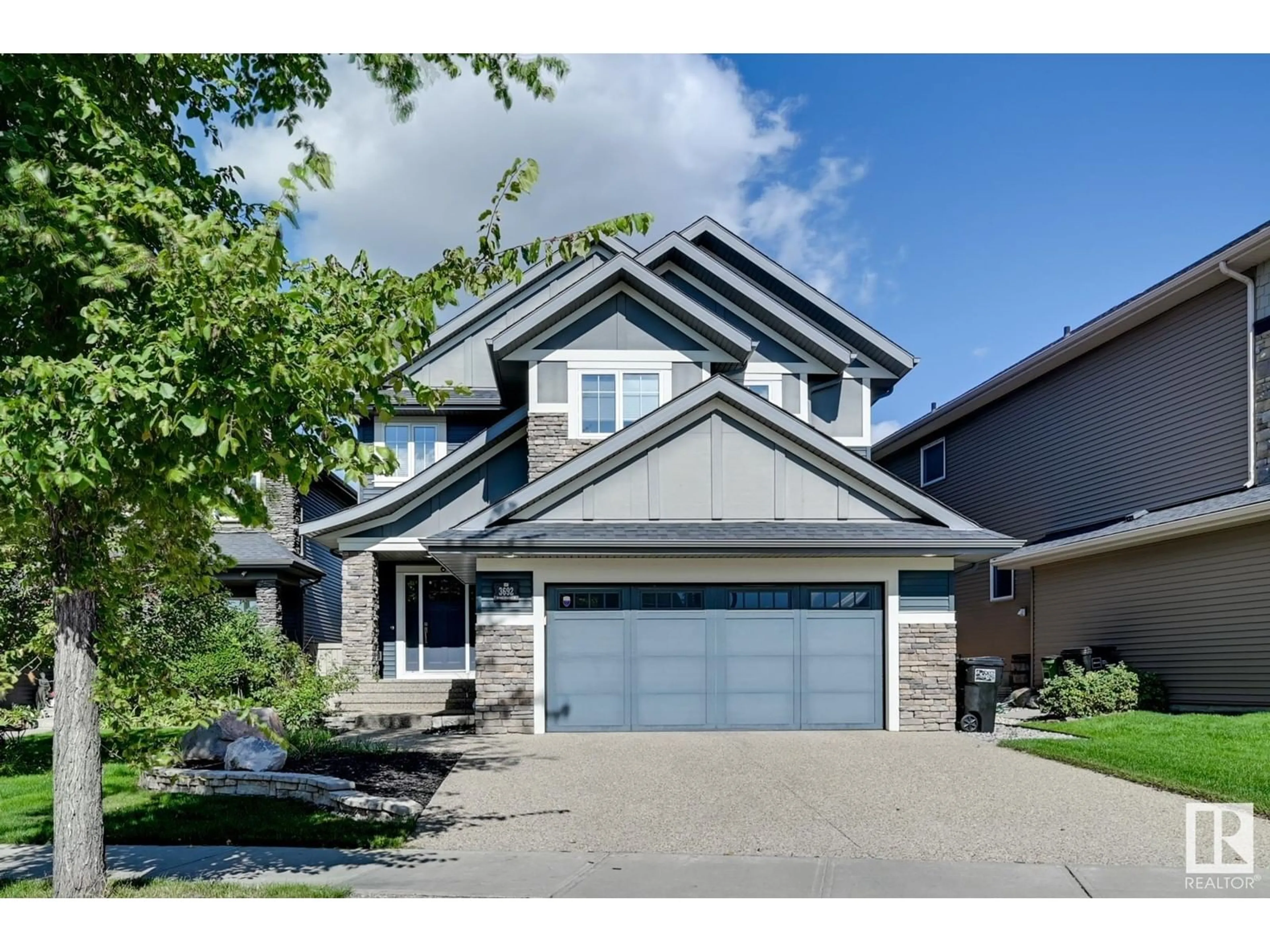 Home with vinyl exterior material, street for 3692 KESWICK BV SW, Edmonton Alberta T6W2P7