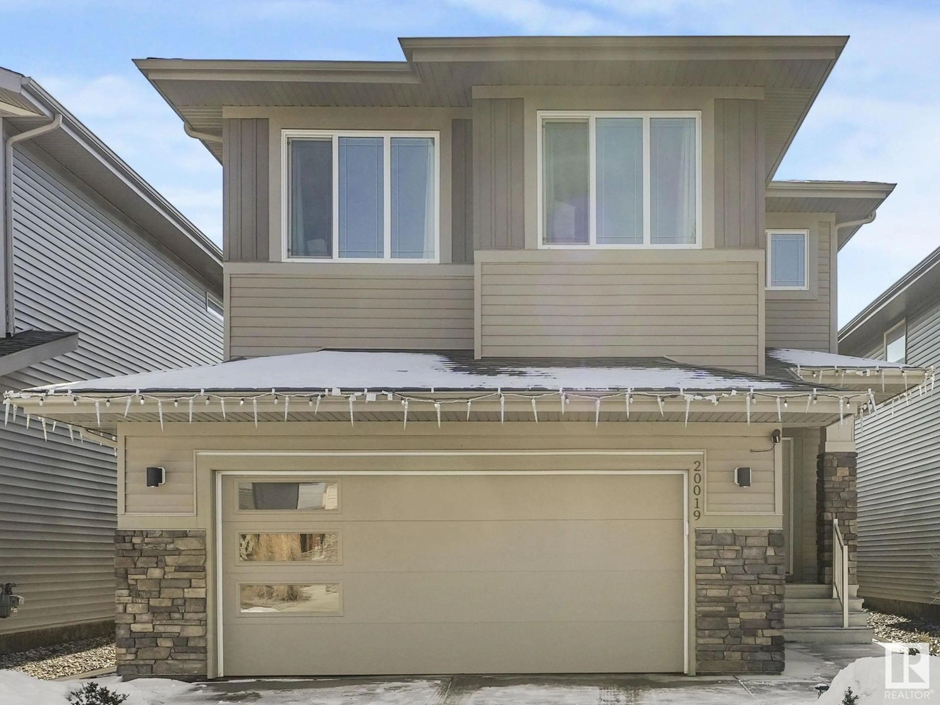 Home with vinyl exterior material, street for NW - 20019 29 AV, Edmonton Alberta T6M0W8