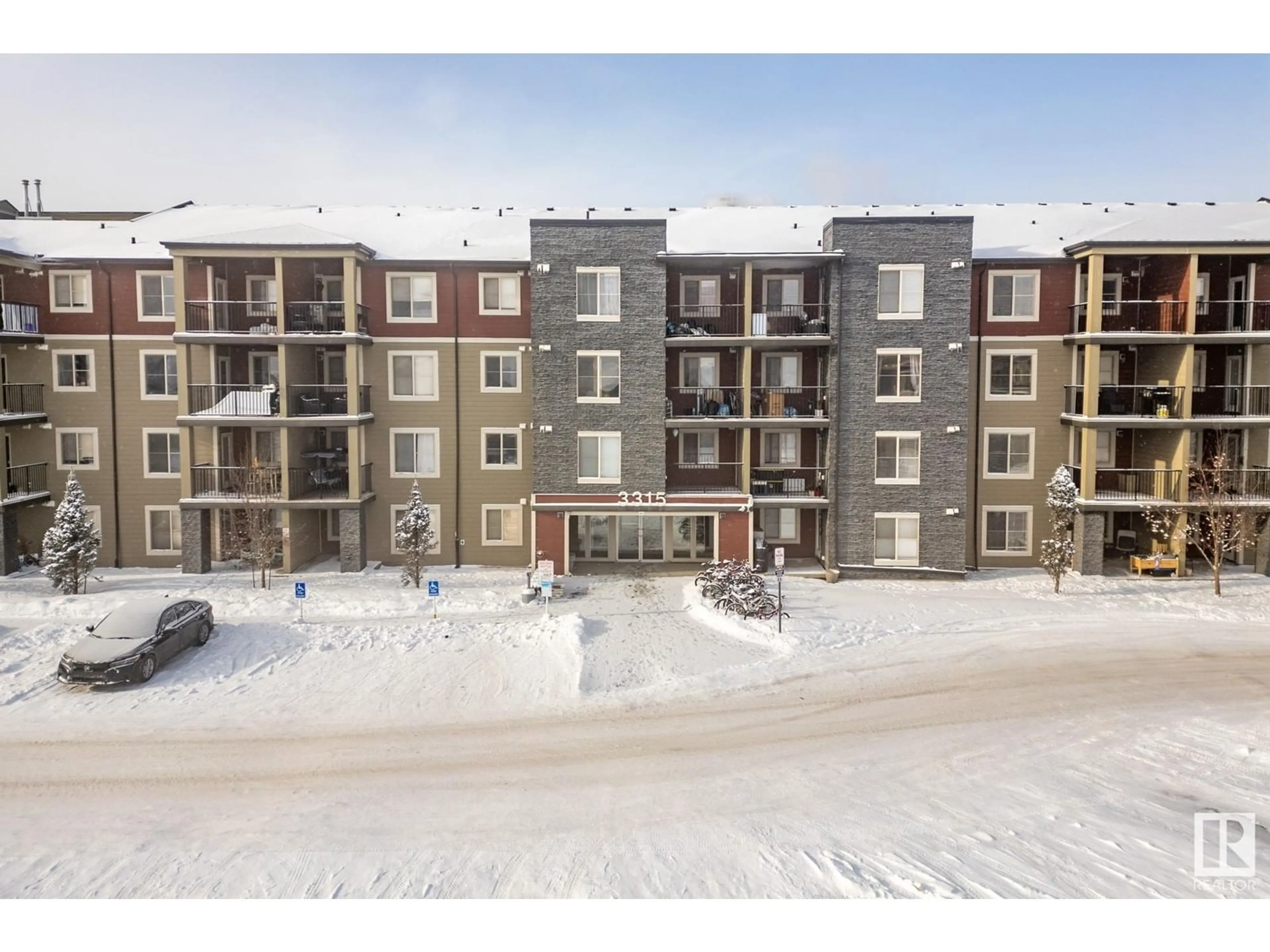 A pic from outside/outdoor area/front of a property/back of a property/a pic from drone, building for #409 3315 JAMES MOWATT TR SW, Edmonton Alberta T6W3L9