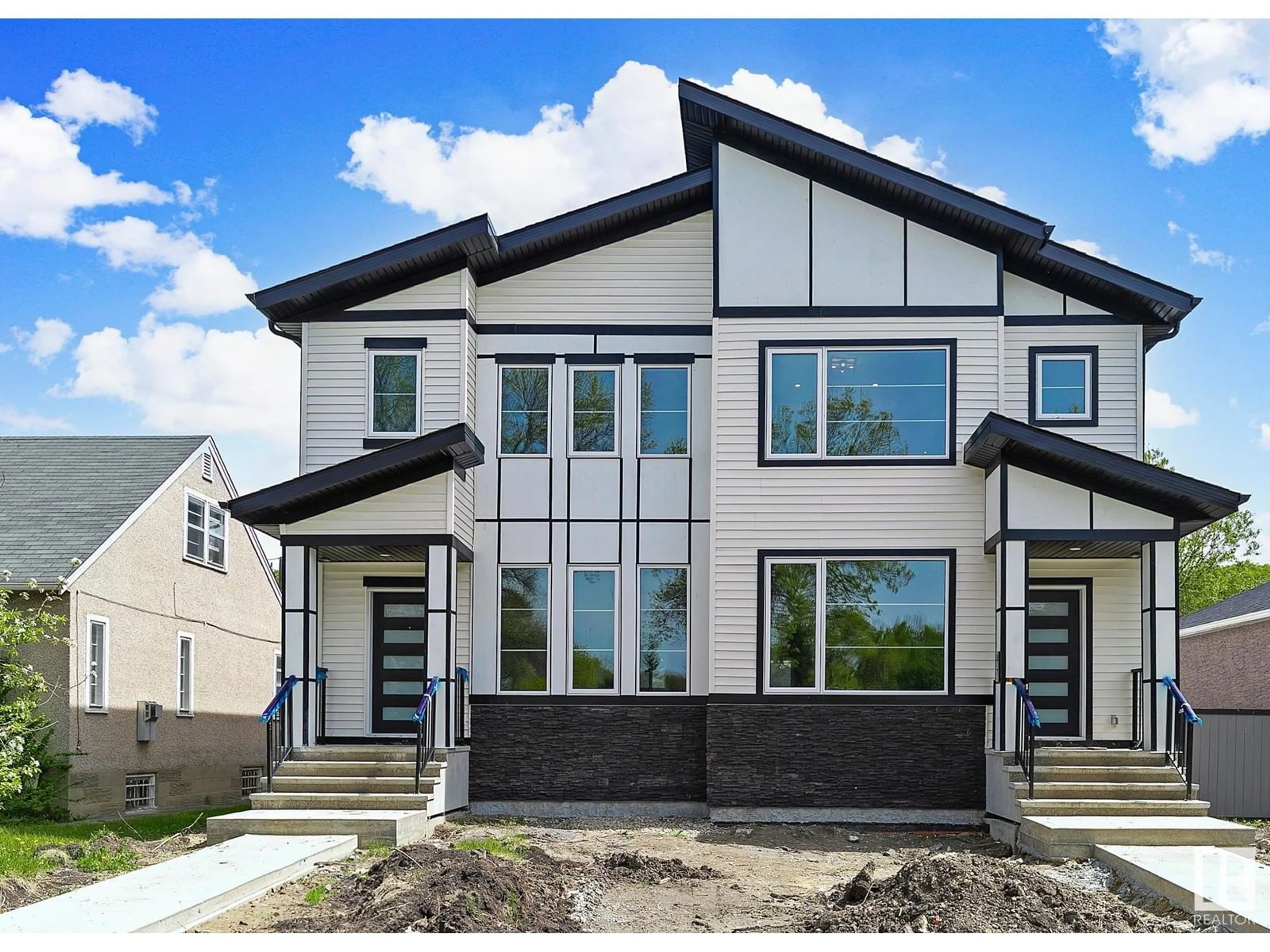 Home with vinyl exterior material, street for 11633 ST ALBERT TR NW, Edmonton Alberta T5M3L6