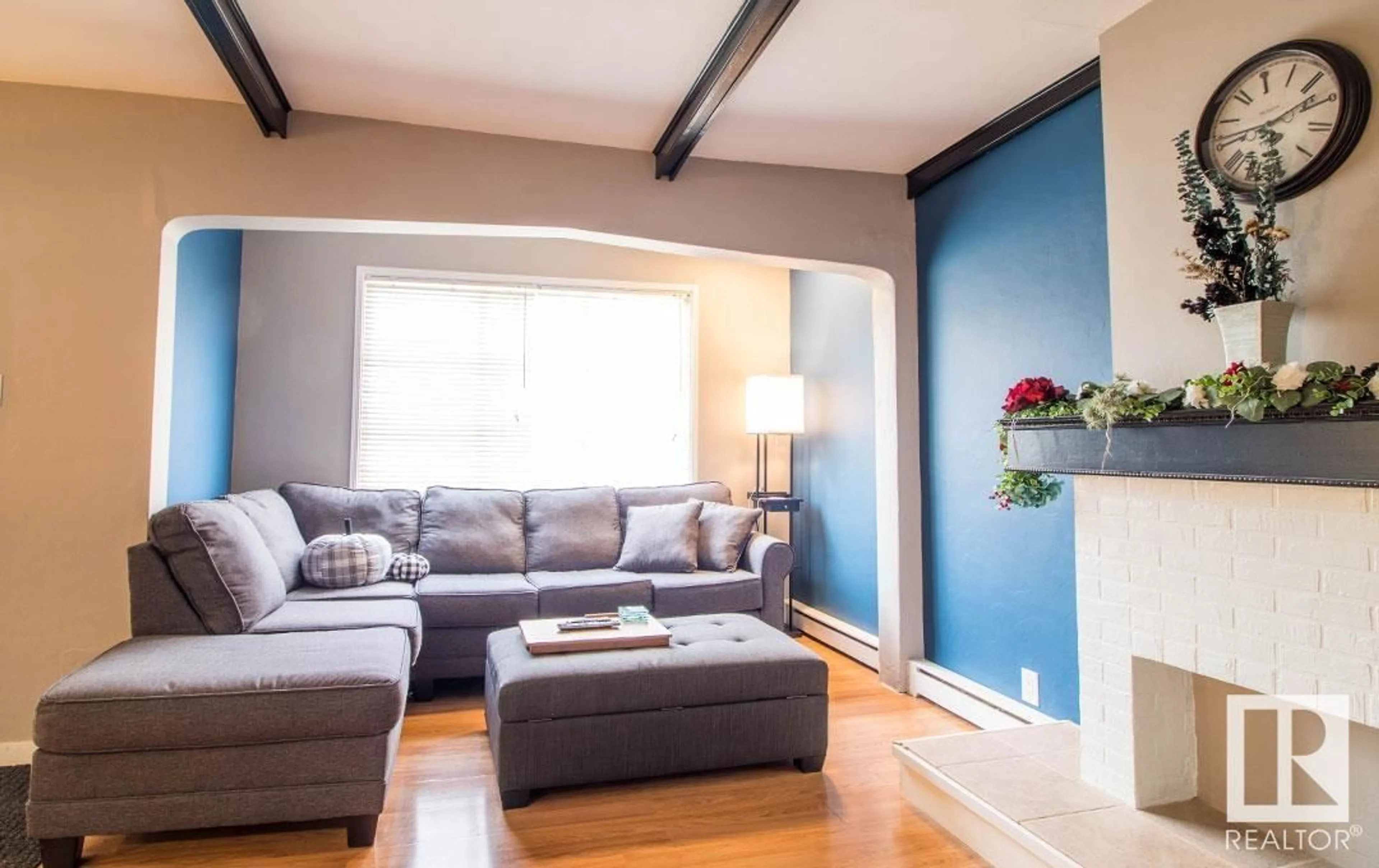 Living room with furniture, wood/laminate floor for 11239 105 ST, Edmonton Alberta T5G2M4
