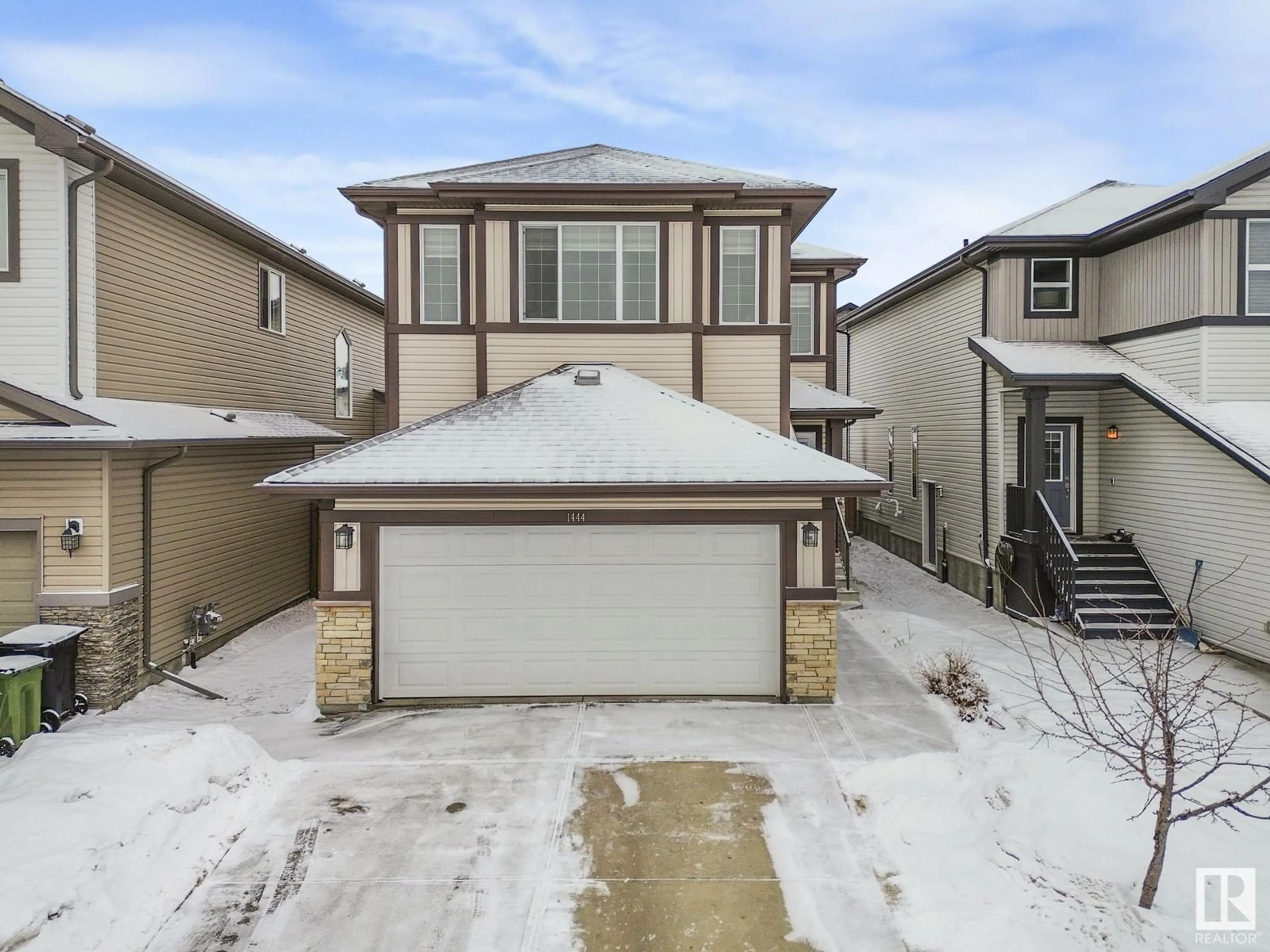 Home with vinyl exterior material, street for 1444 30 ST, Edmonton Alberta T6T0Z5