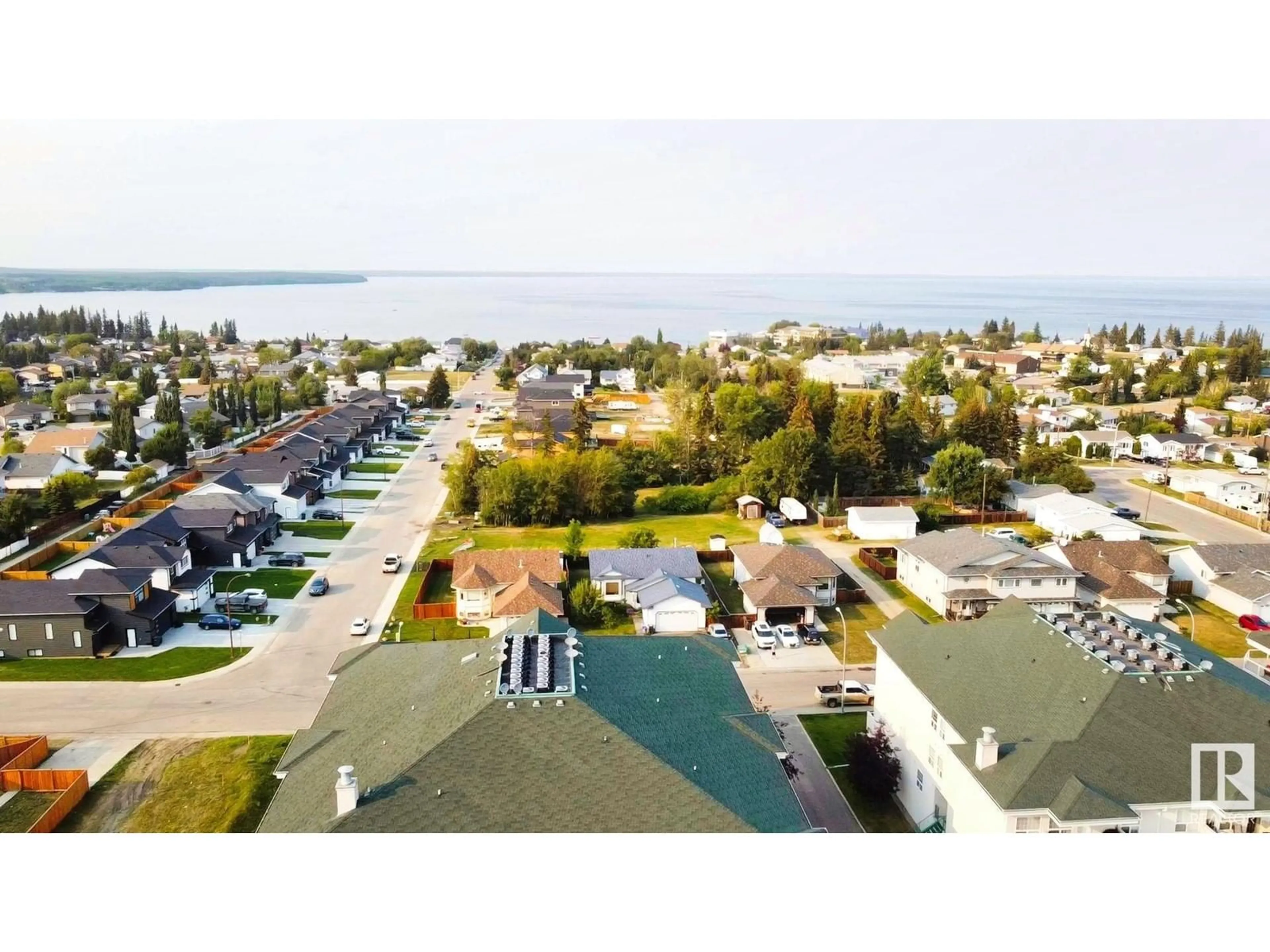 A pic from outside/outdoor area/front of a property/back of a property/a pic from drone, water/lake/river/ocean view for #302 - 1705 7 AV, Cold Lake Alberta T9M0A6