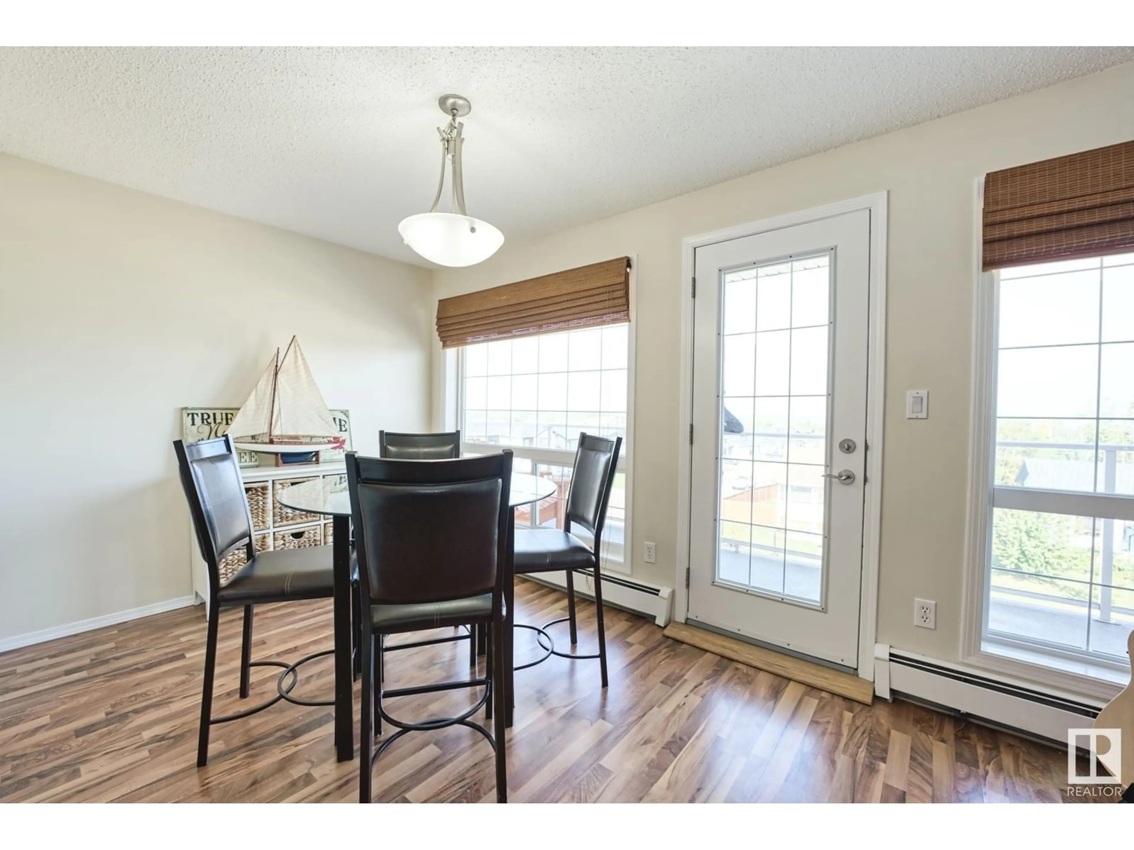 Dining room, wood/laminate floor for #302 - 1705 7 AV, Cold Lake Alberta T9M0A6