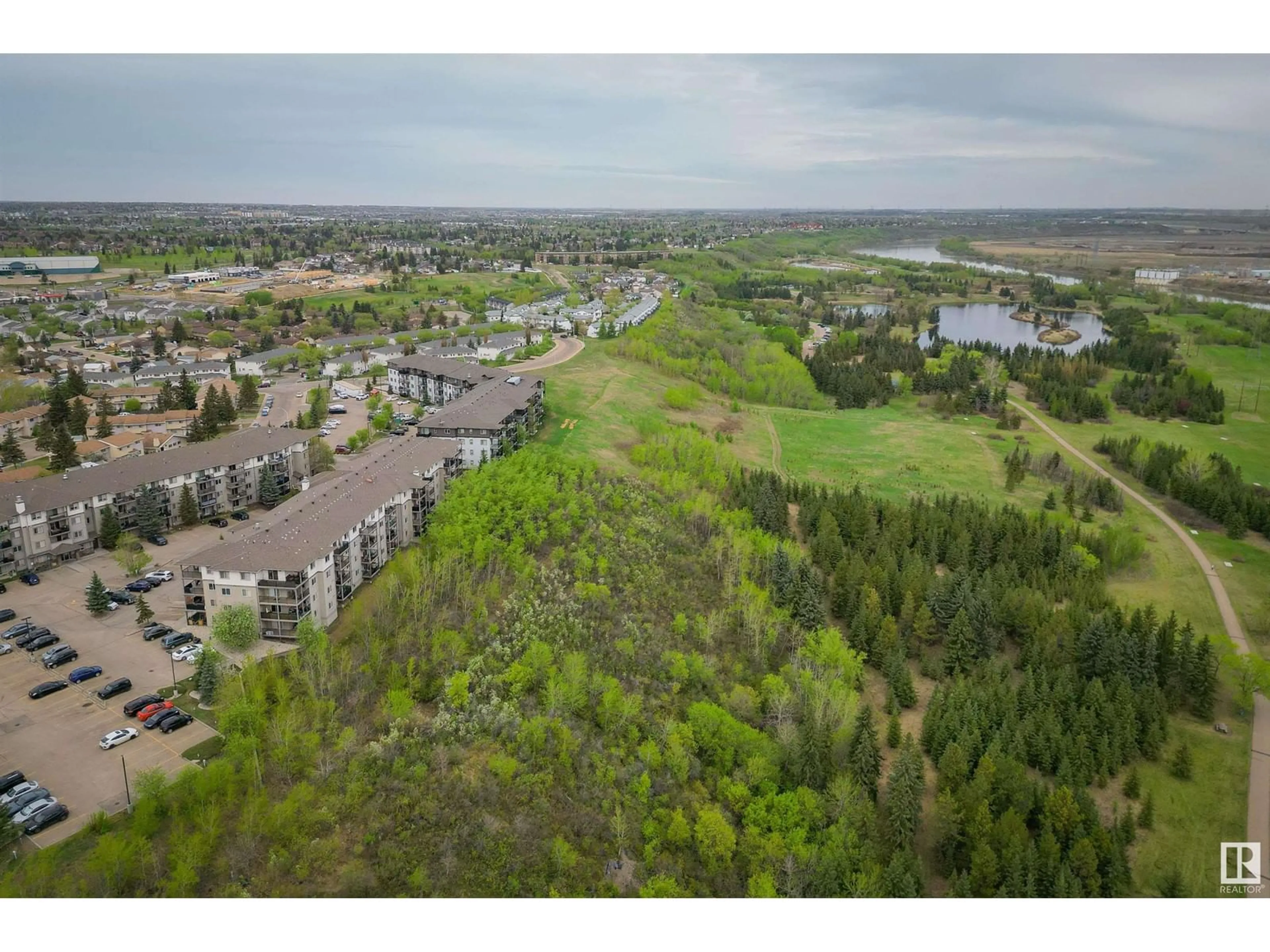 A pic from outside/outdoor area/front of a property/back of a property/a pic from drone, water/lake/river/ocean view for 1188 - 110 HYNDMAN RD, Edmonton Alberta T5A0E9