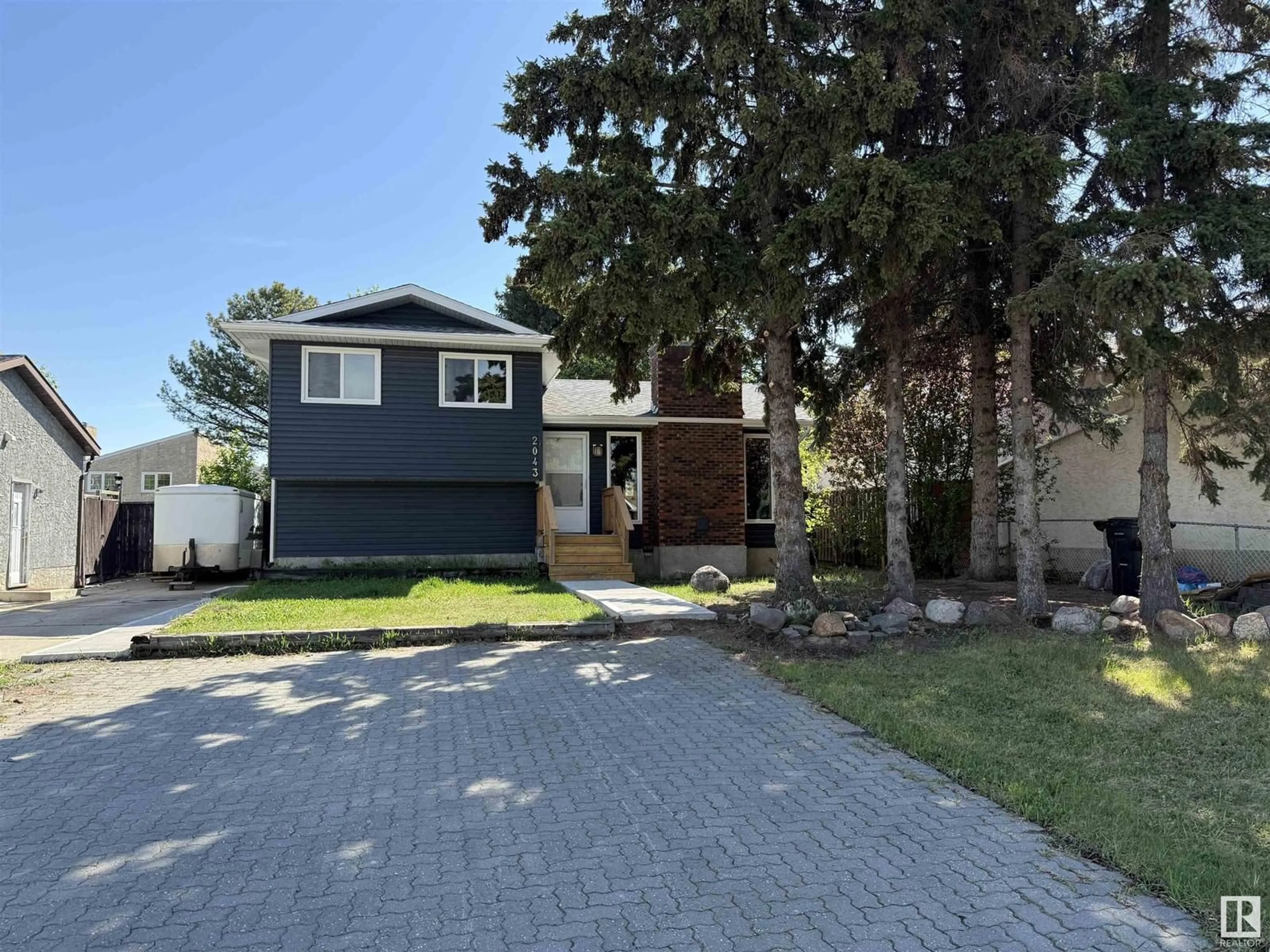 Home with vinyl exterior material, street for NW - 2043 49A ST, Edmonton Alberta T6L2W9