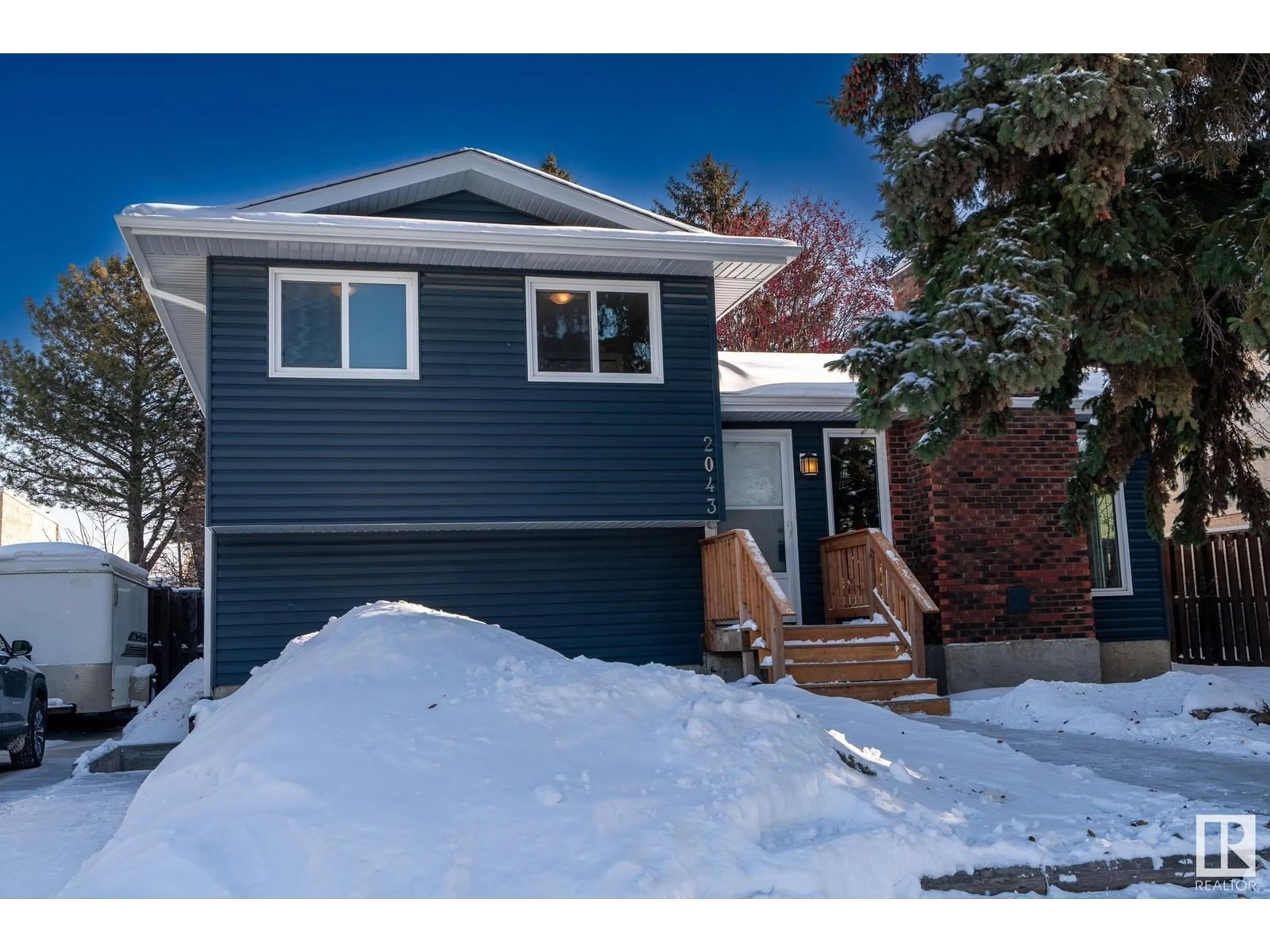 Home with vinyl exterior material, street for NW - 2043 49A ST, Edmonton Alberta T6L2W9