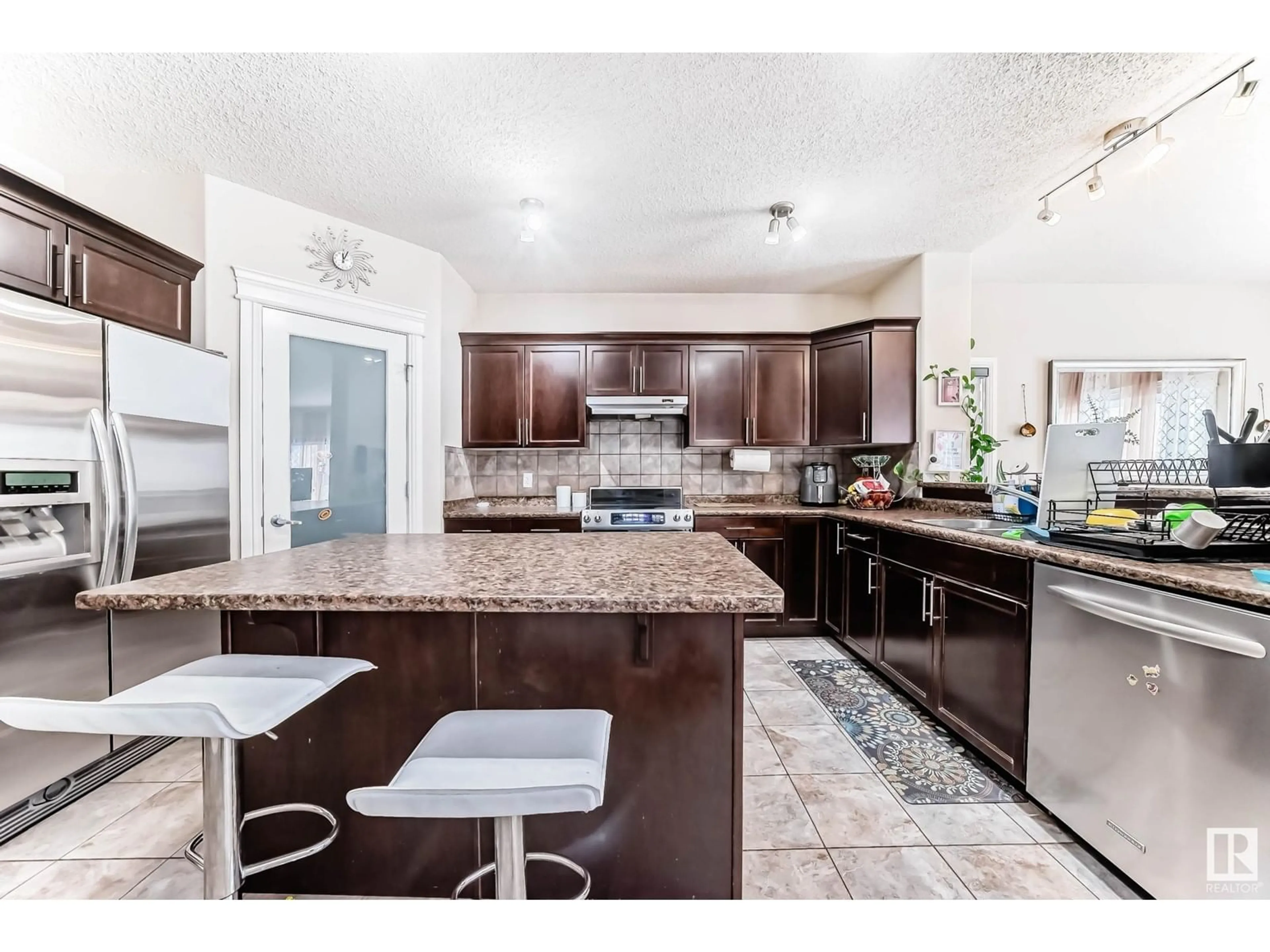 Open concept kitchen, ceramic/tile floor for 6159 12 AV SW, Edmonton Alberta T6X0M5