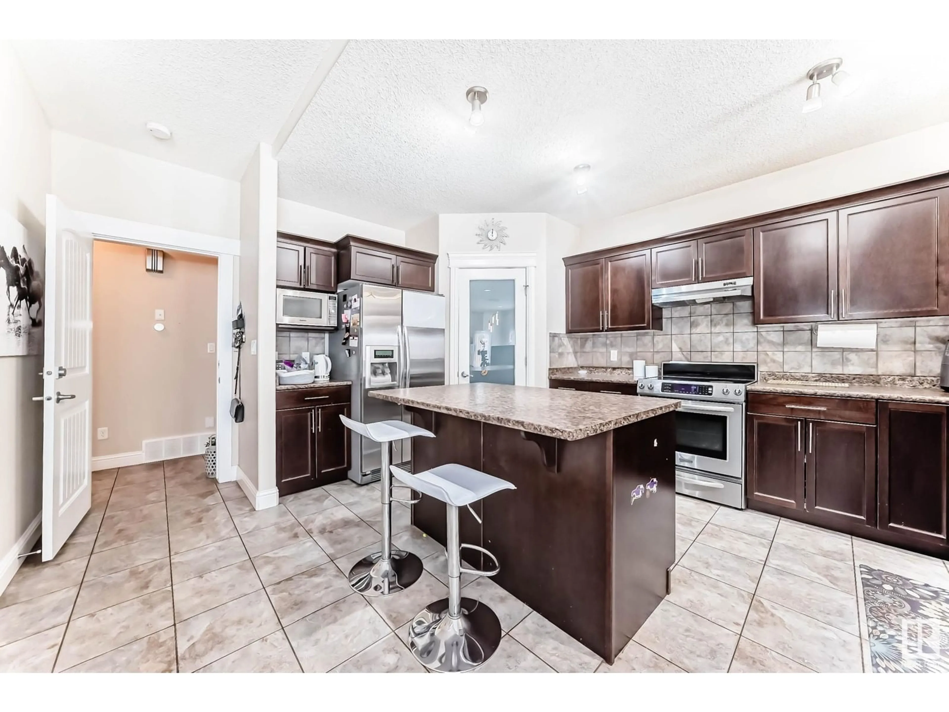 Open concept kitchen, ceramic/tile floor for 6159 12 AV SW, Edmonton Alberta T6X0M5