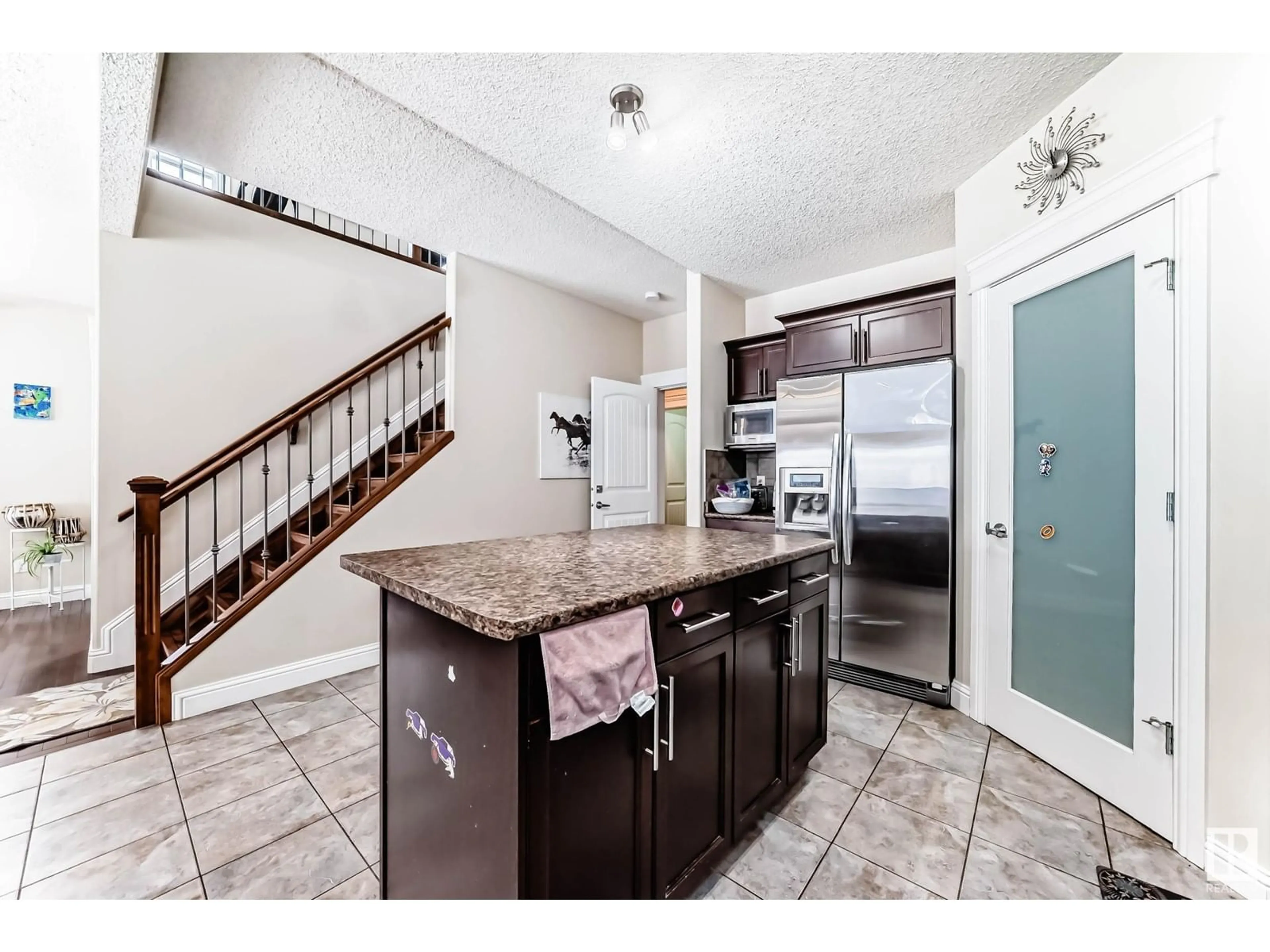 Open concept kitchen, ceramic/tile floor for 6159 12 AV SW, Edmonton Alberta T6X0M5
