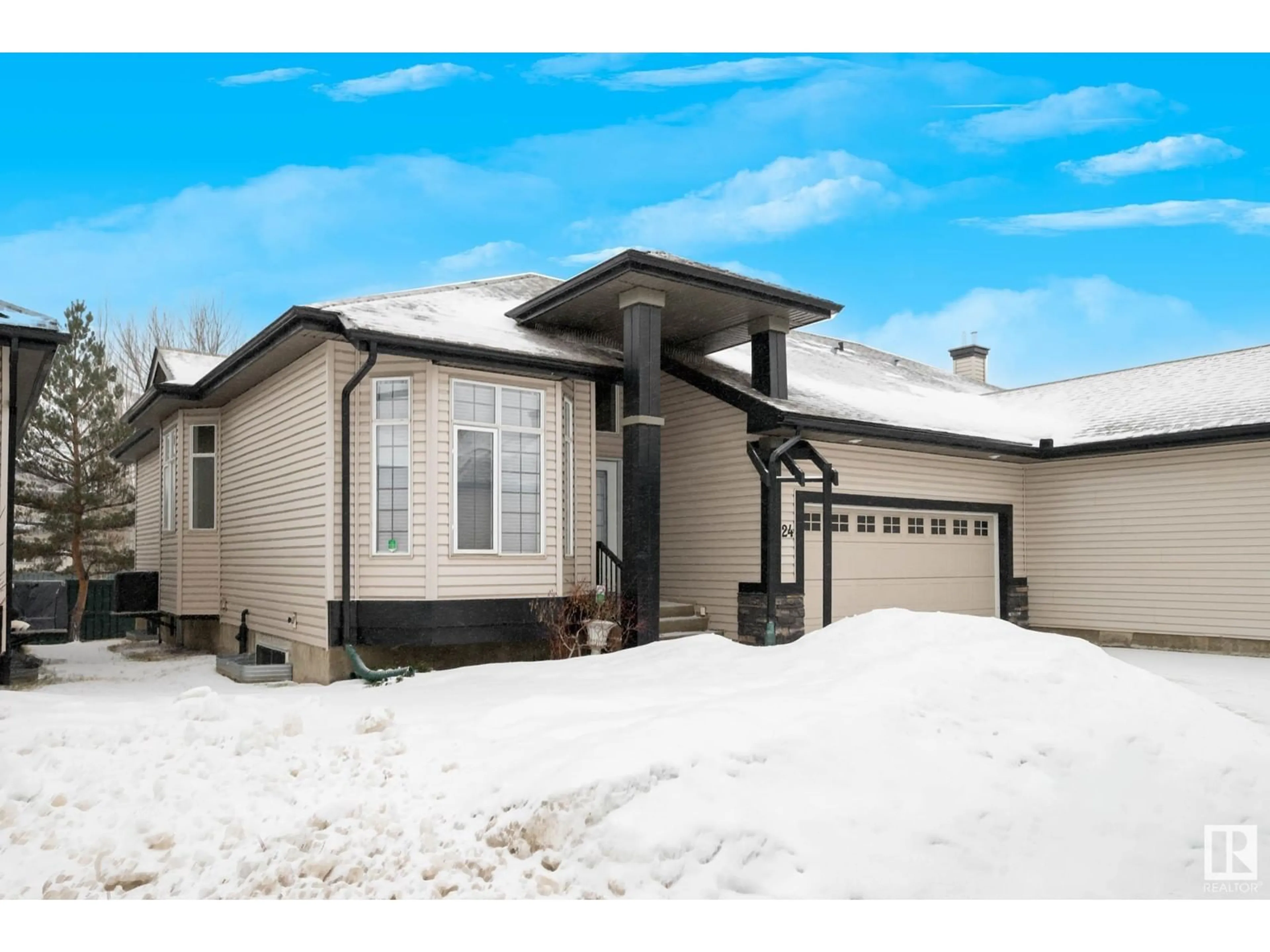 Home with vinyl exterior material, street for #24 12610 15 AV SW, Edmonton Alberta T6W1X1