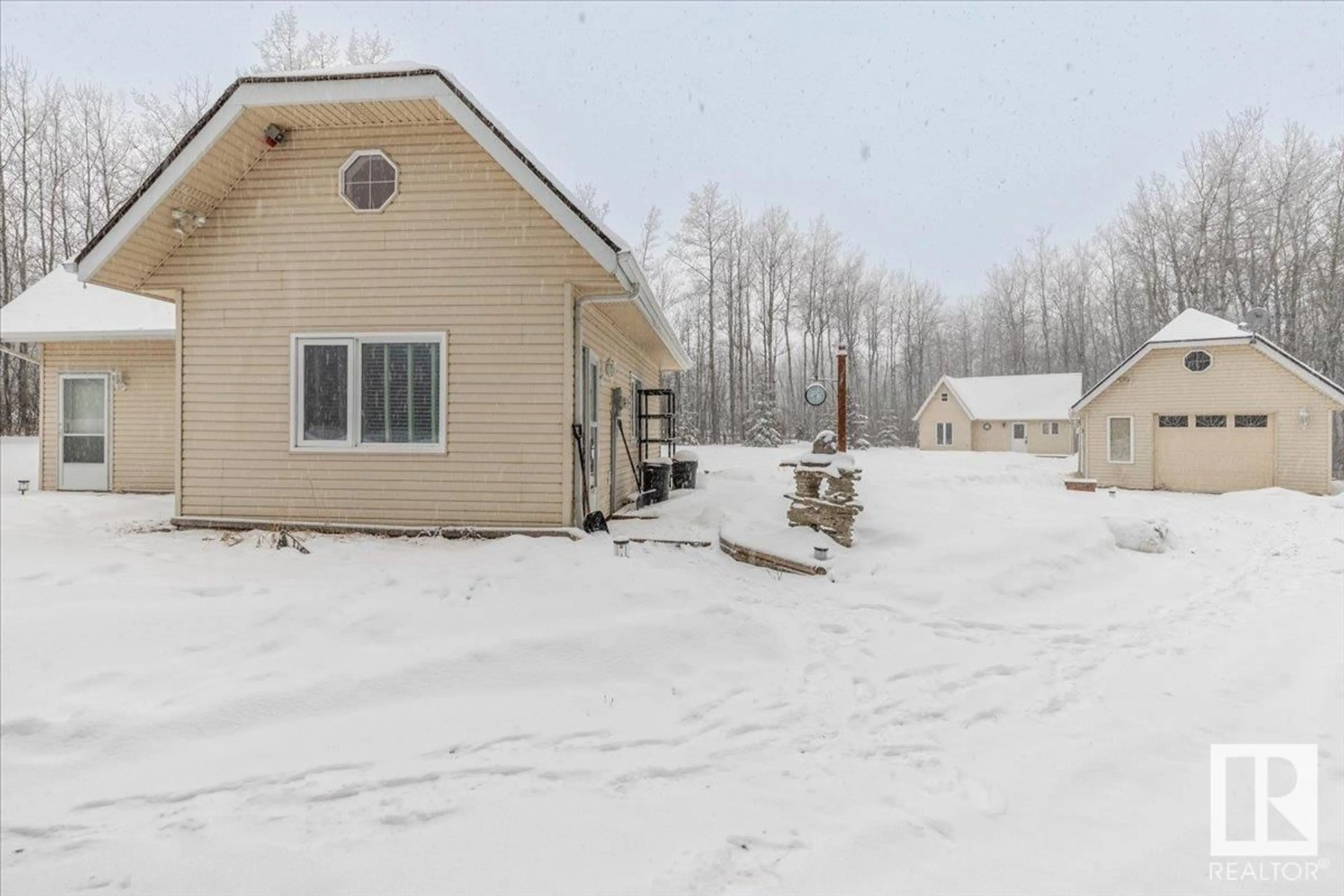 Home with vinyl exterior material, street for 473068 - 10 RGE ROAD 11, Rural Wetaskiwin County Alberta T0C2C0