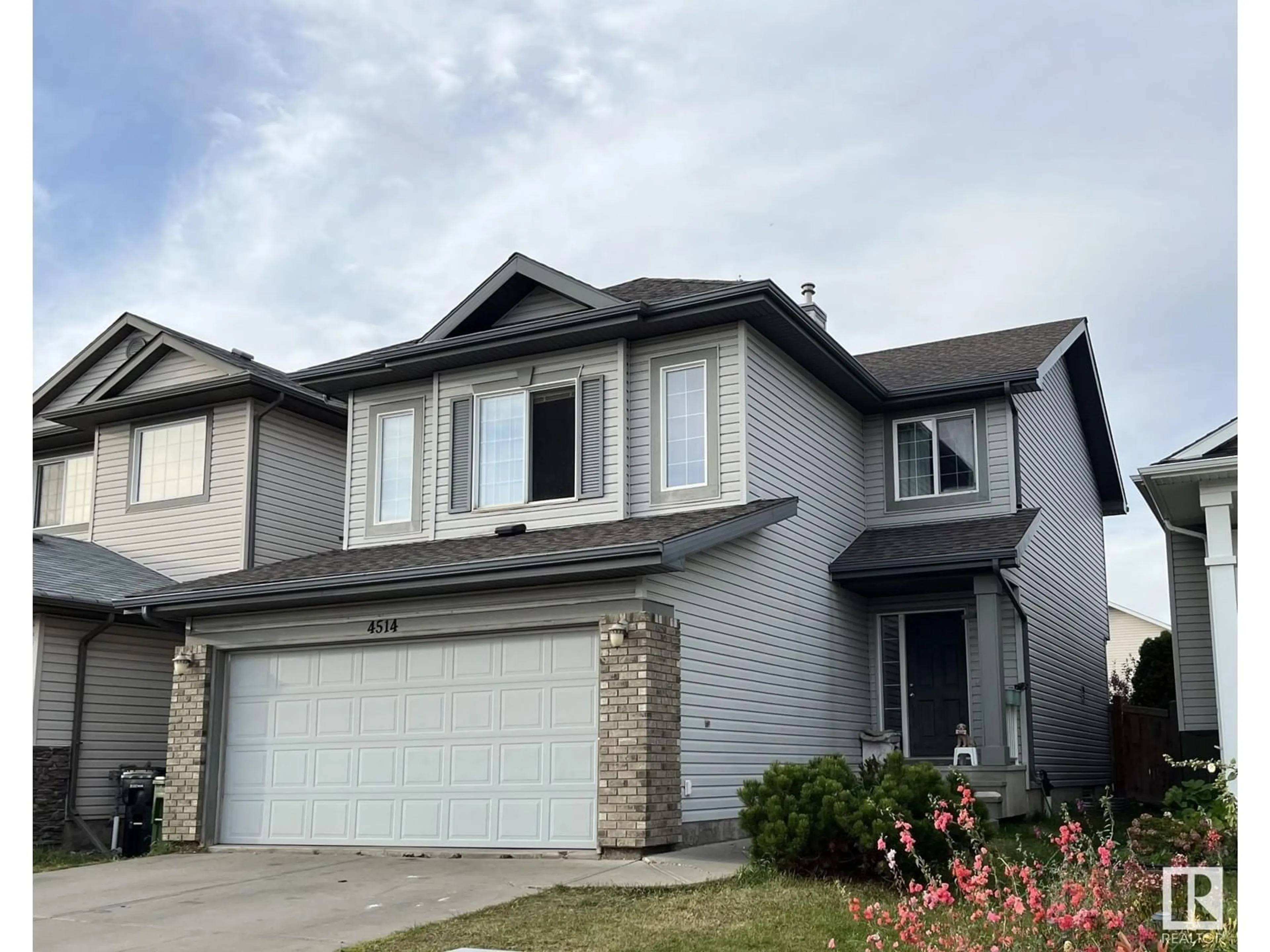 Home with vinyl exterior material, street for 4514 163A AV, Edmonton Alberta T5Y3H7