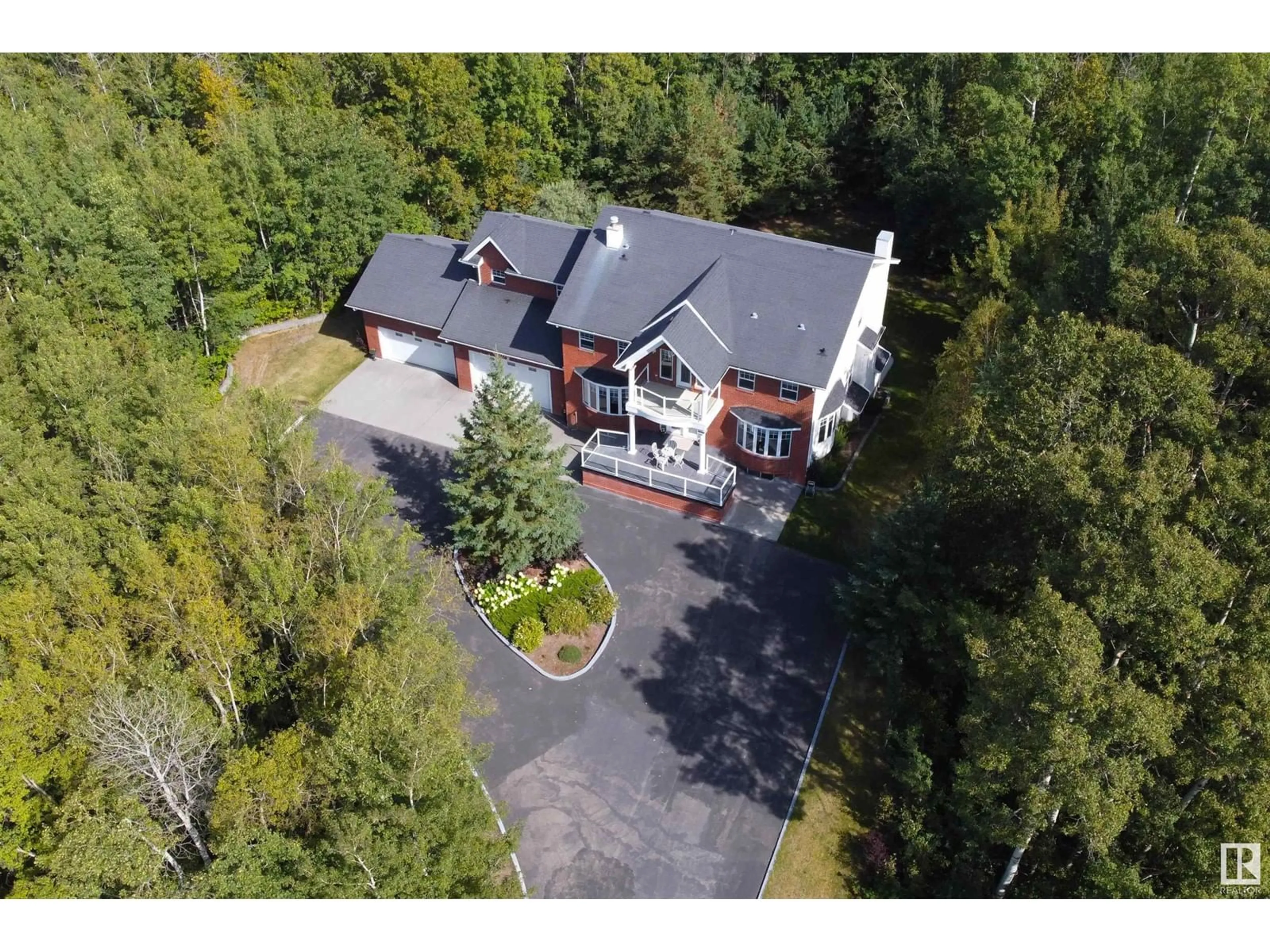 A pic from outside/outdoor area/front of a property/back of a property/a pic from drone, unknown for 338 - 52147 RGE RD 231, Rural Strathcona County Alberta T8B1A4