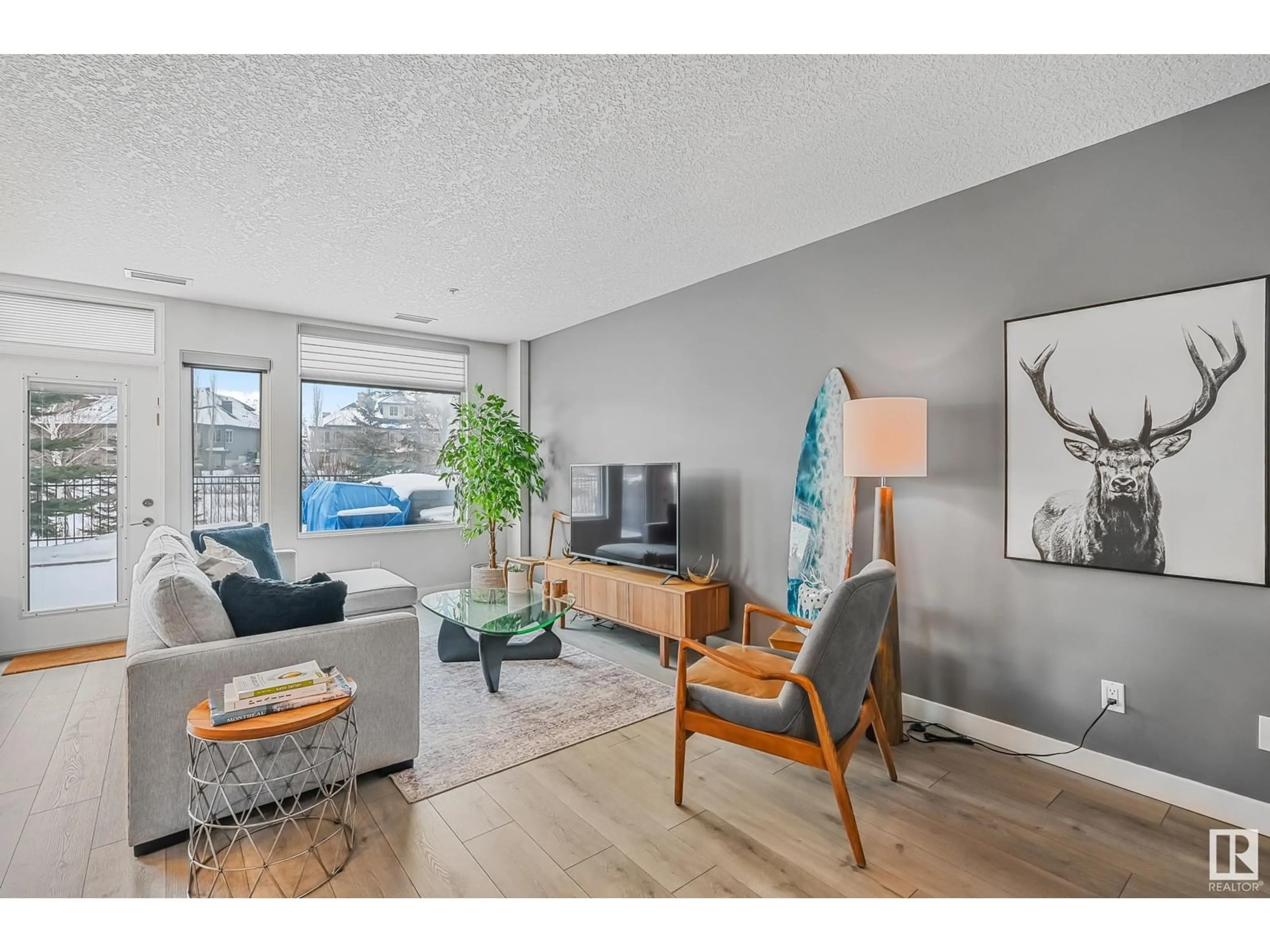 Living room with furniture, wood/laminate floor for #127 5151 WINDERMERE BV SW, Edmonton Alberta T6W2K4