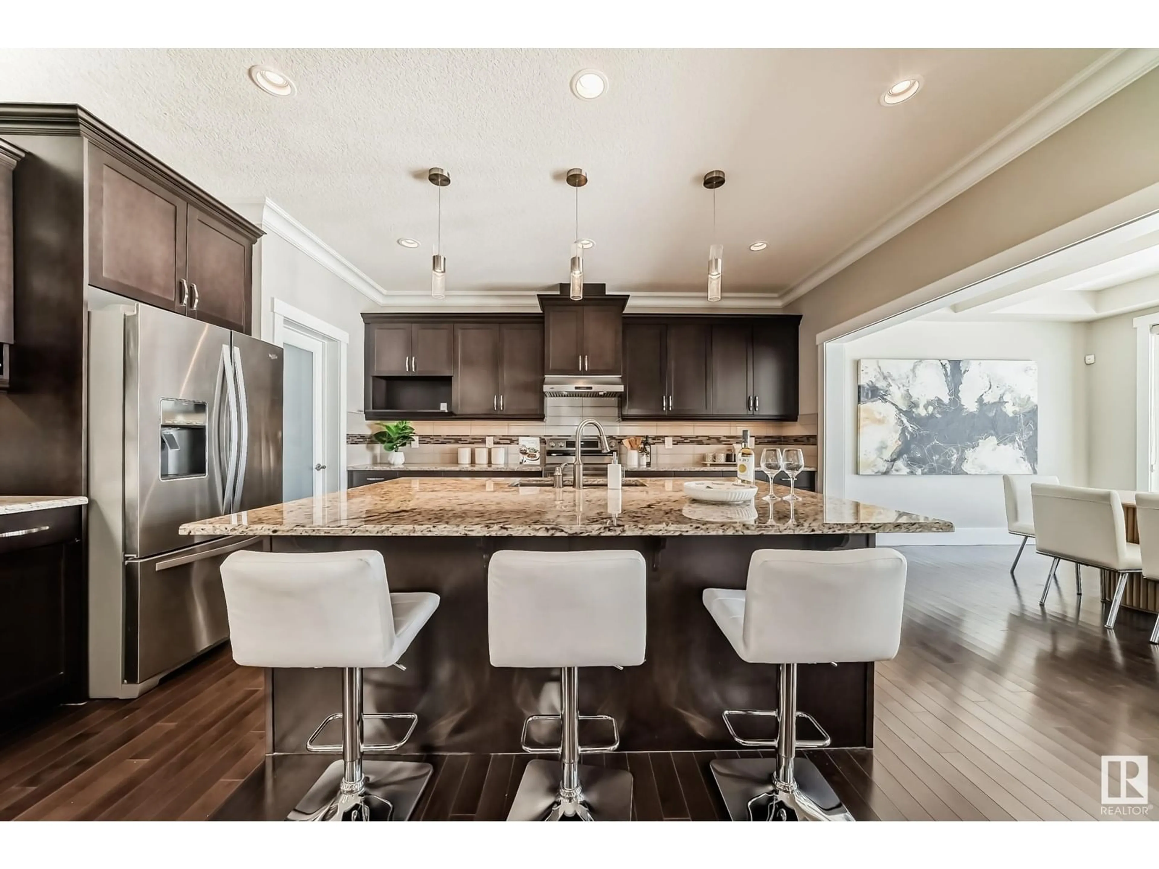 Open concept kitchen, wood/laminate floor for 1620 AINSLIE LN SW, Edmonton Alberta T6W0H5