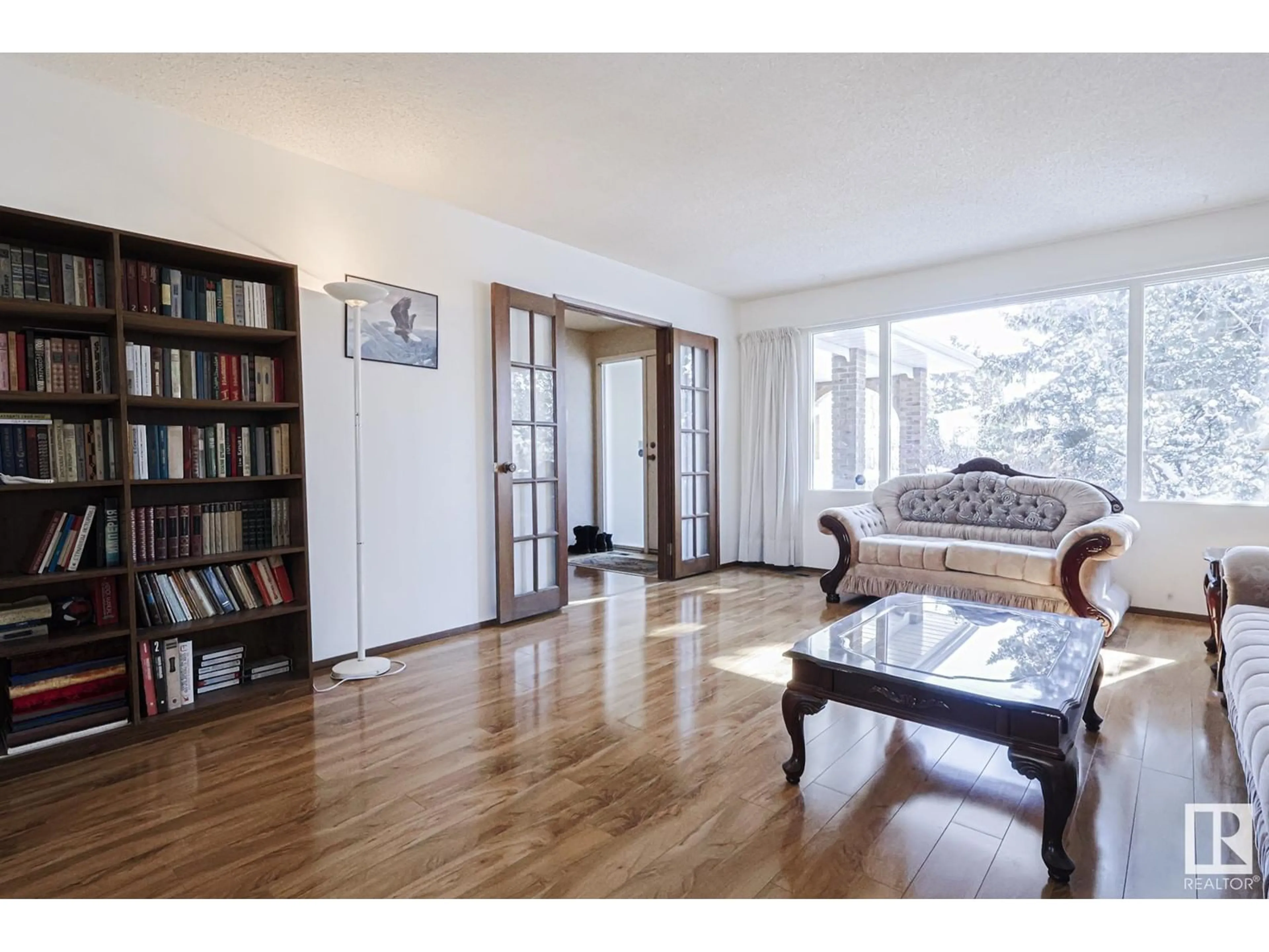 Living room with furniture, wood/laminate floor for 18506 92A AV NW, Edmonton Alberta T5T1V4