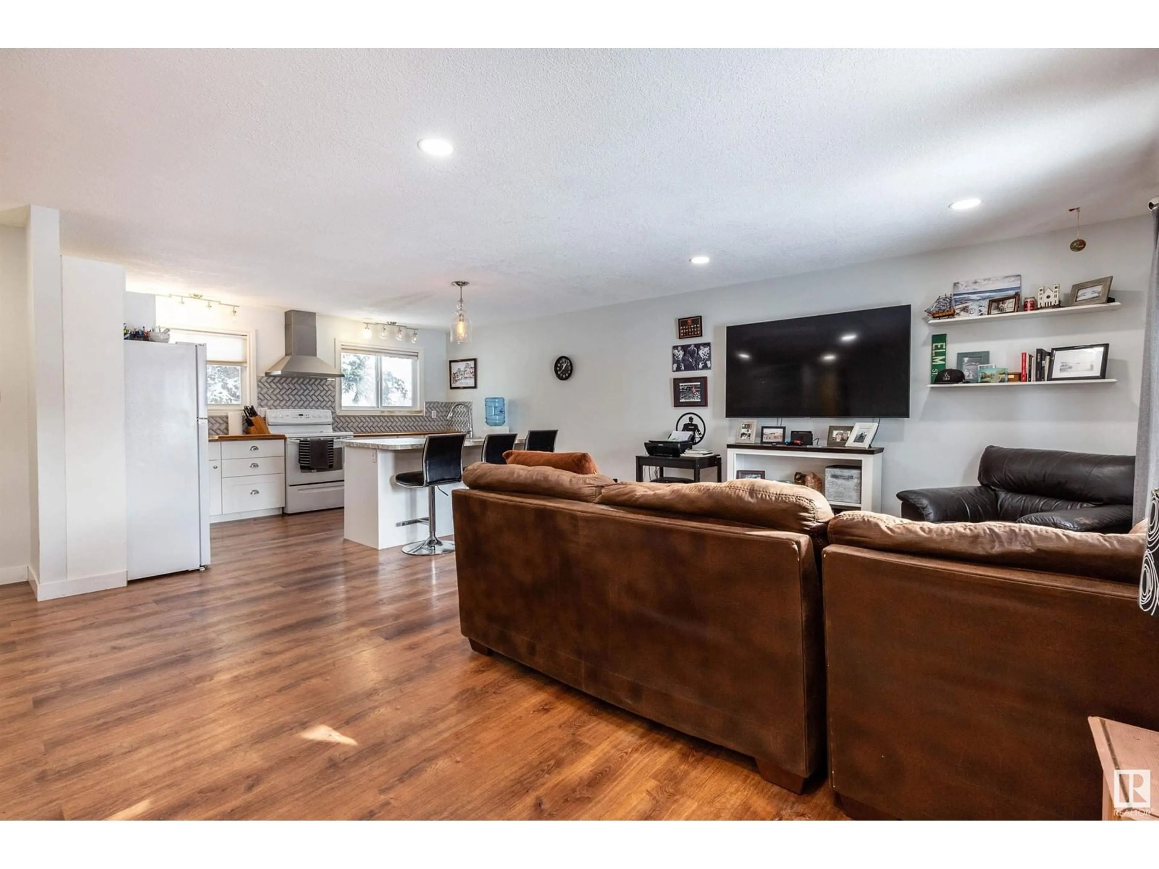 Open concept kitchen, wood/laminate floor for 4916 50A AV, Entwistle Alberta T0E0S0