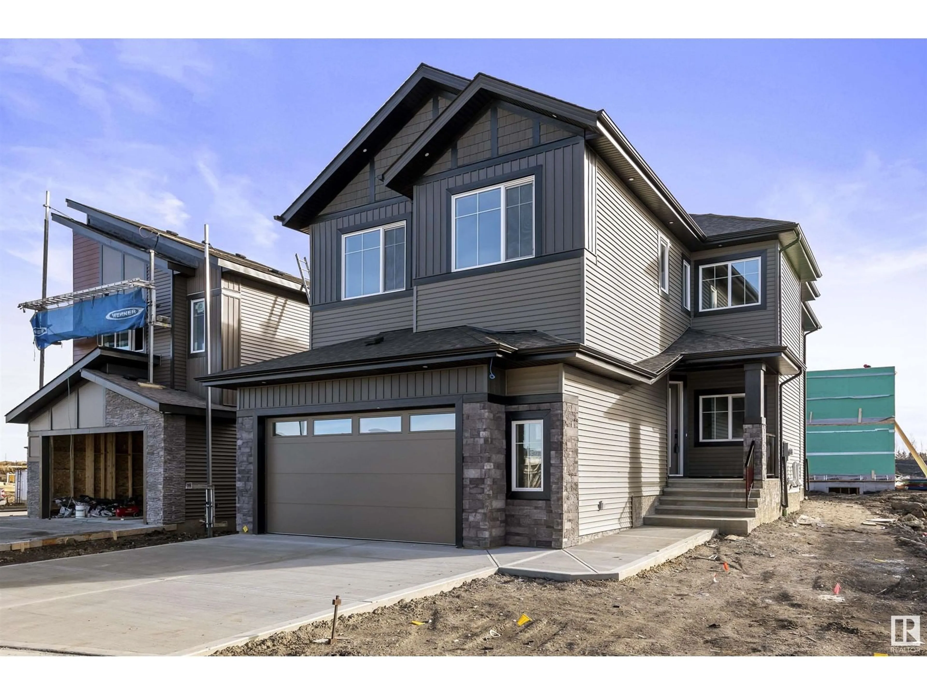 Home with vinyl exterior material, street for NE - 6309 17 ST, Rural Leduc County Alberta T4X3C8