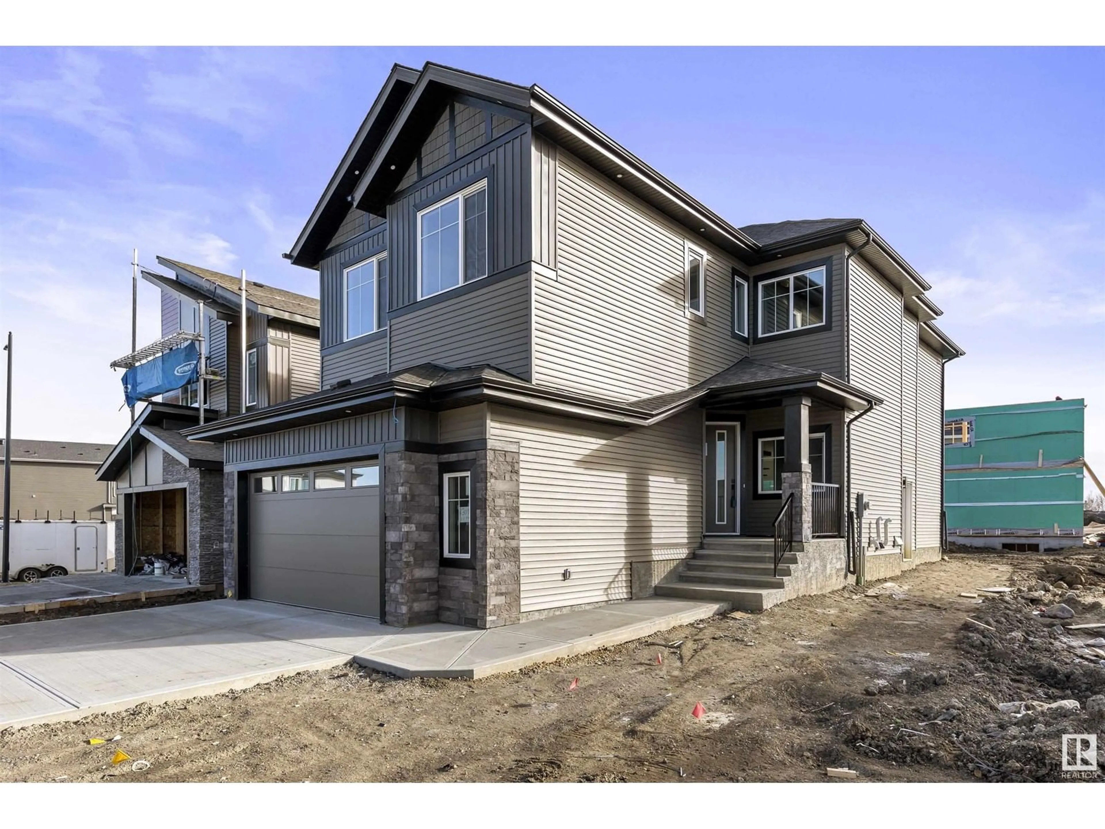 Home with vinyl exterior material, street for NE - 6309 17 ST, Rural Leduc County Alberta T4X3C8