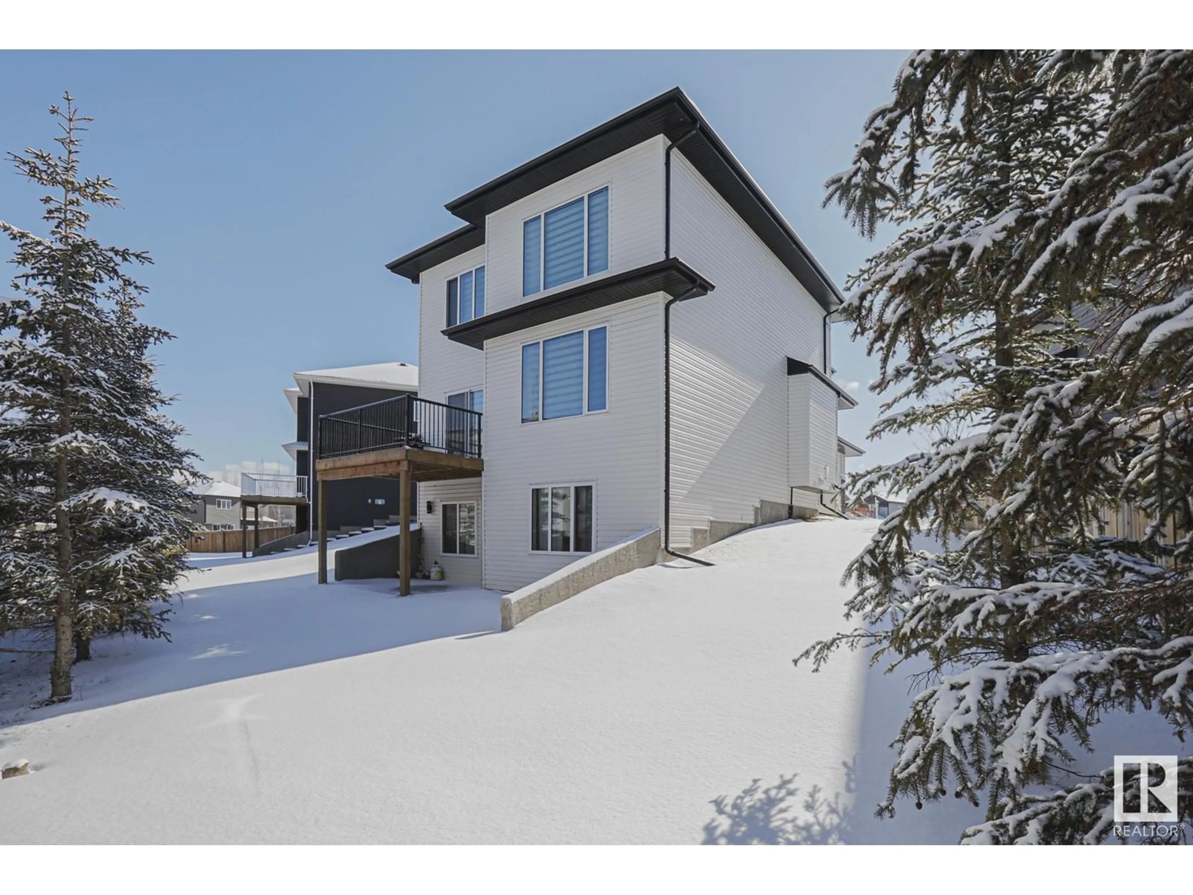A pic from outside/outdoor area/front of a property/back of a property/a pic from drone, mountain view for 84 MEADOWLAND WY, Spruce Grove Alberta T7X0S4