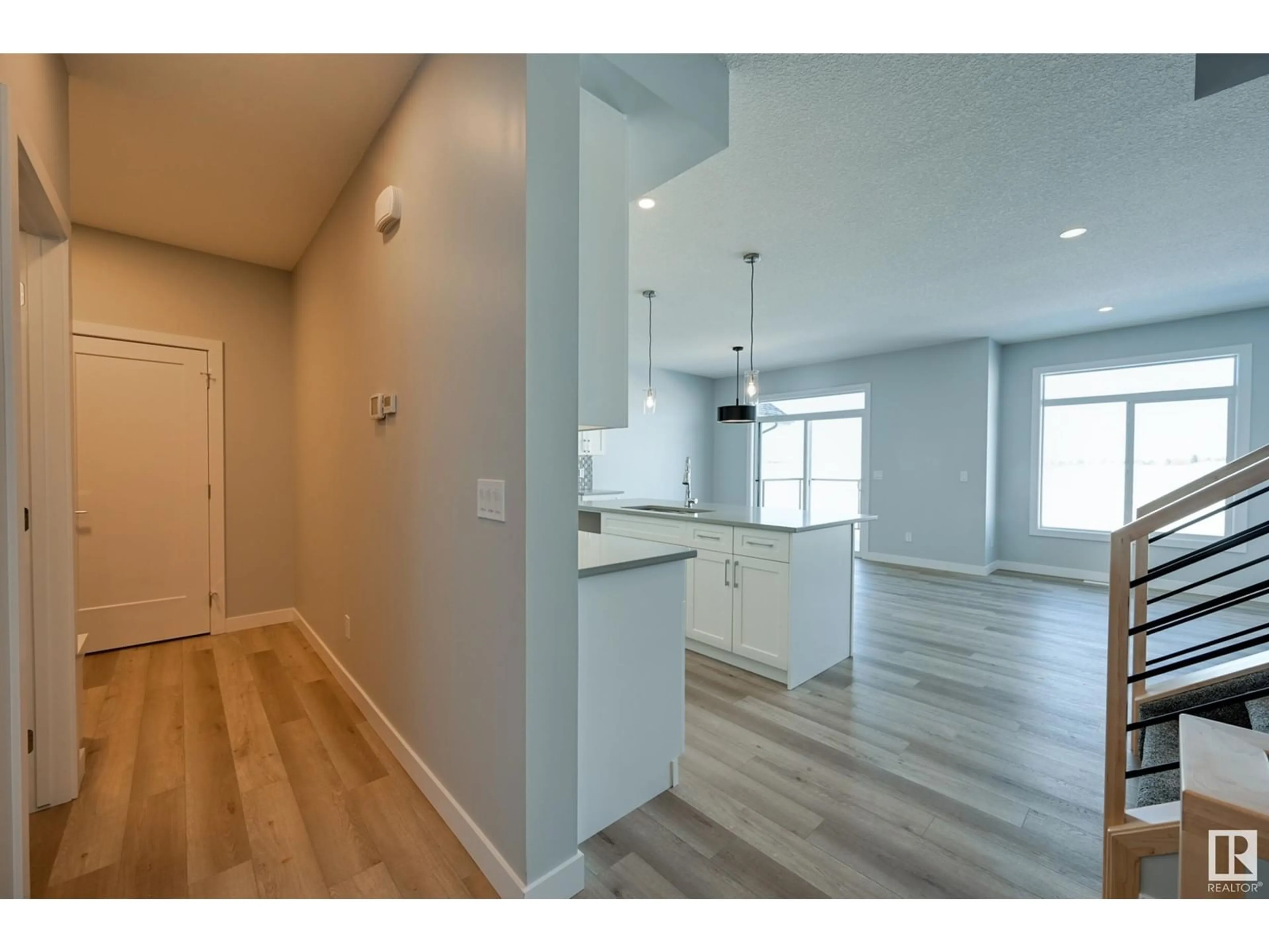 Open concept kitchen, wood/laminate floor for 10214 92A AV, Morinville Alberta T8R2R4
