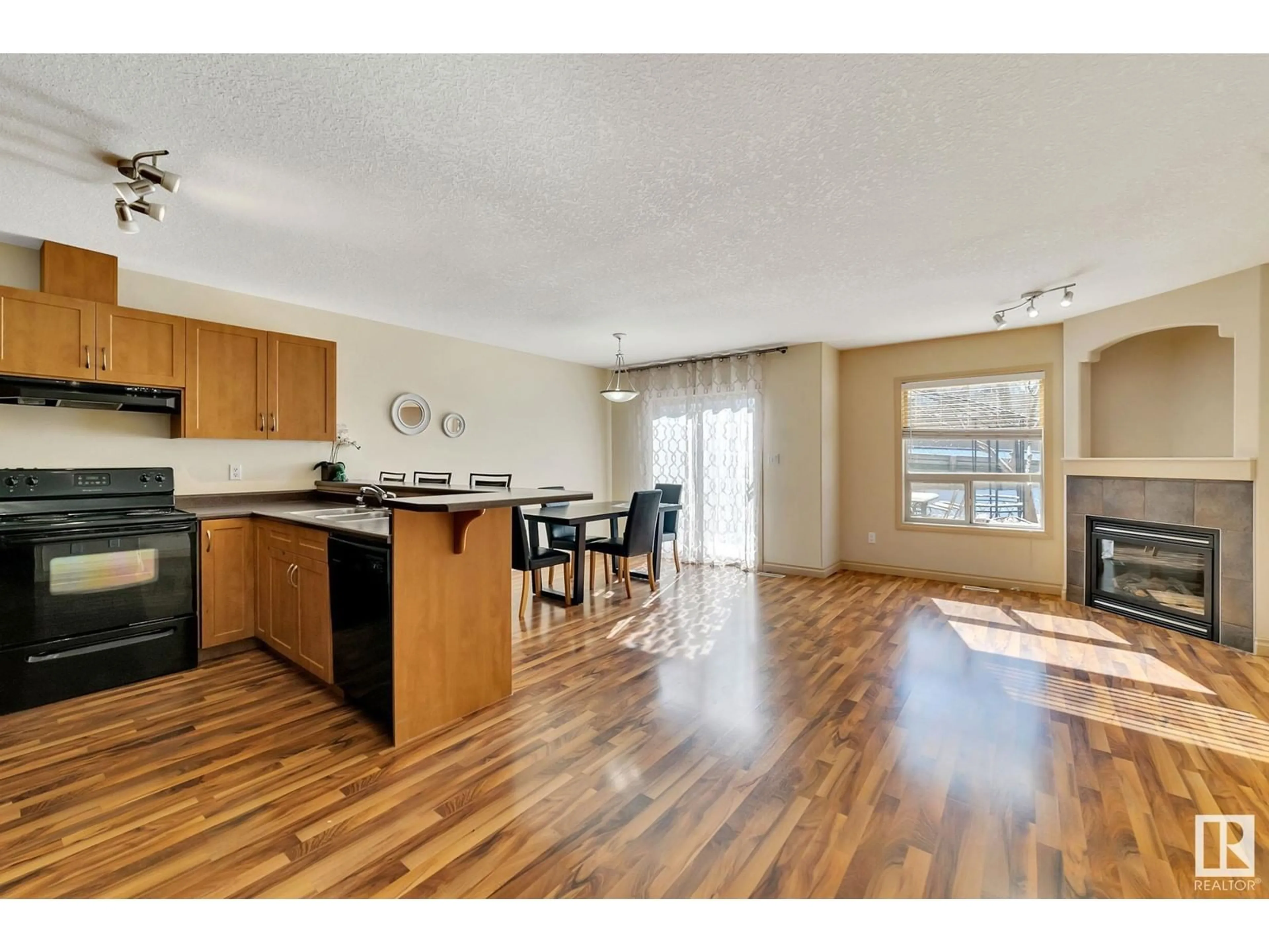 Open concept kitchen, wood/laminate floor for #5 - 16317 64 ST, Edmonton Alberta T5Y3M3