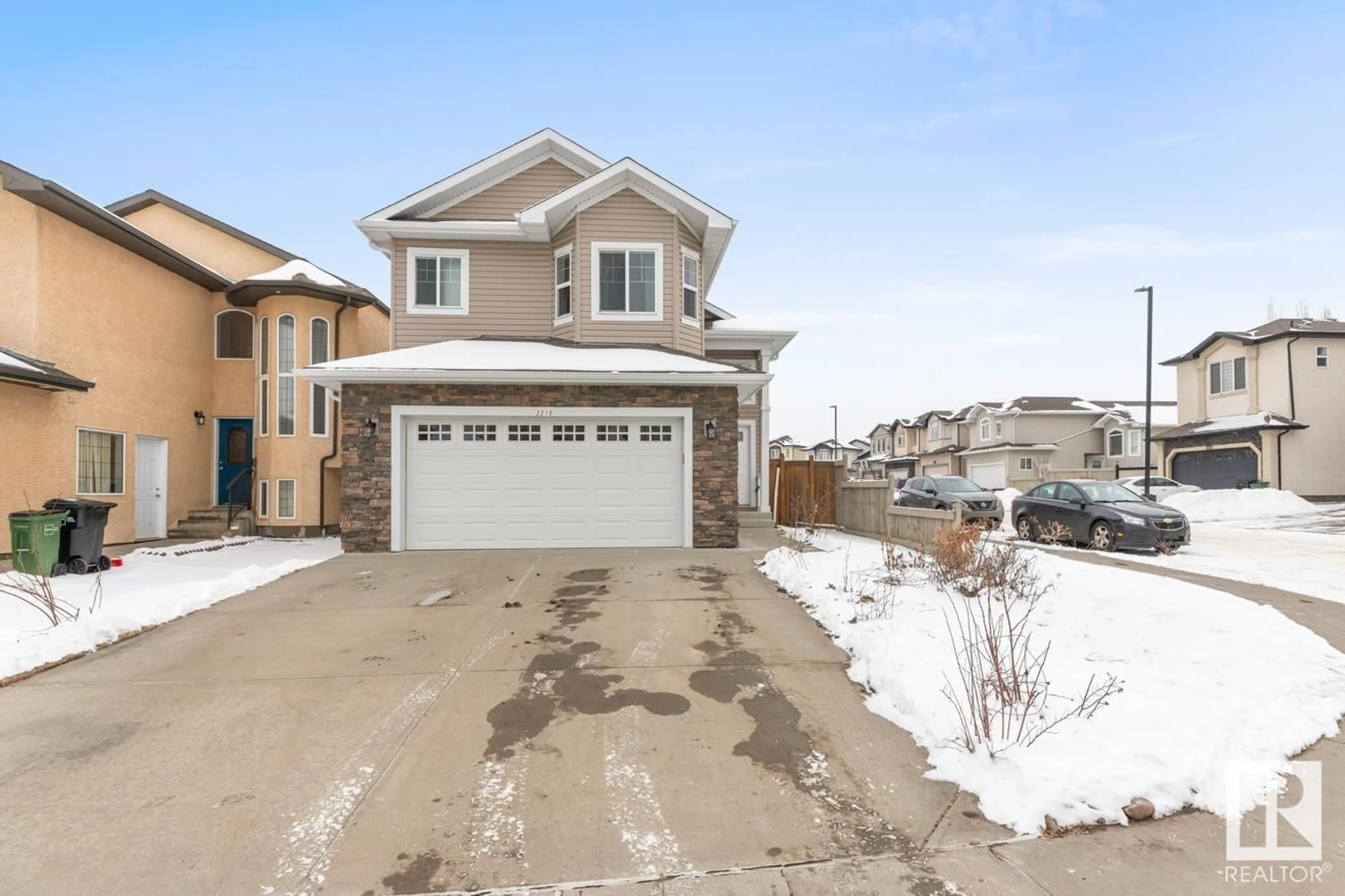 Home with vinyl exterior material, street for NW - 3215 20 ST, Edmonton Alberta T6T0H3