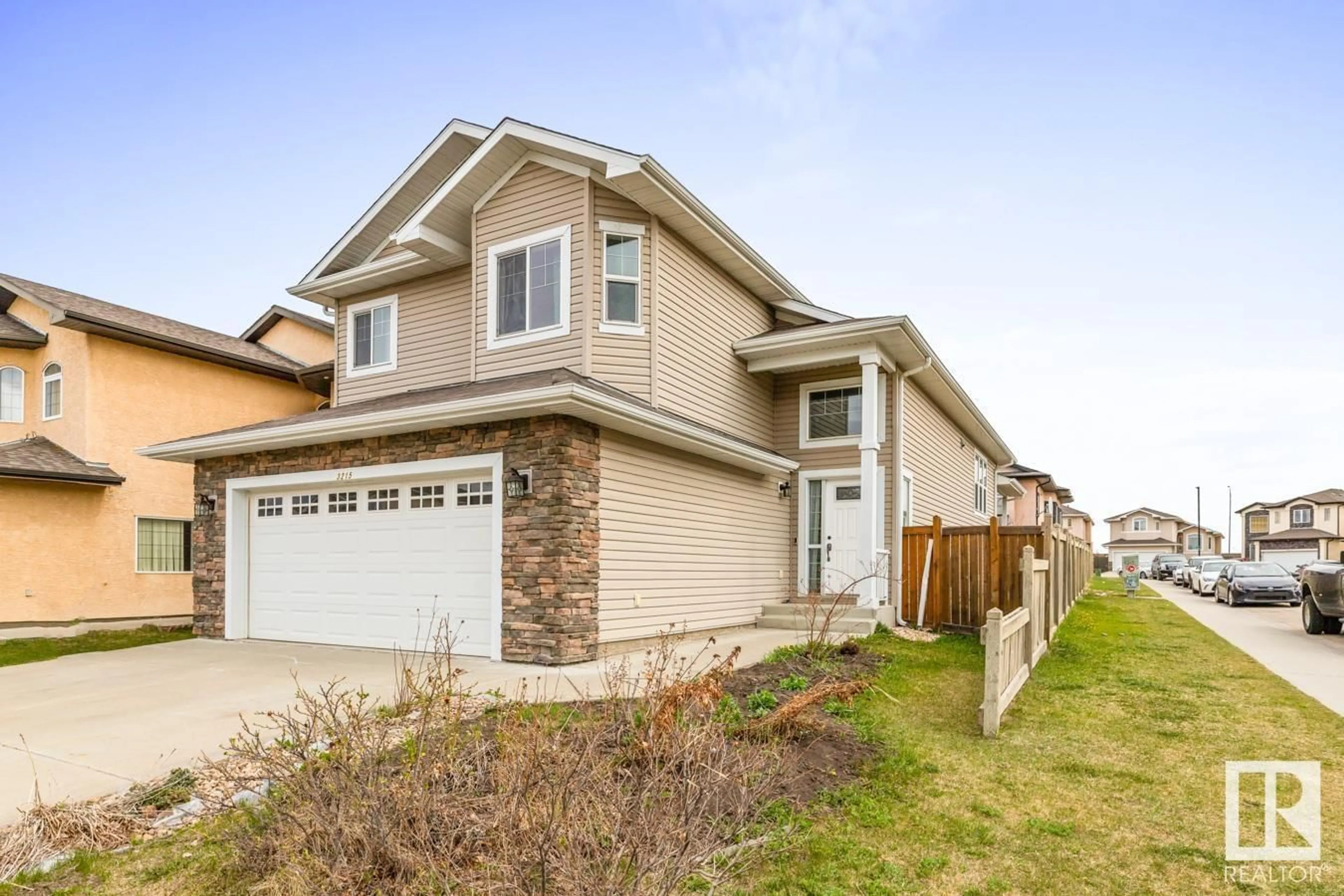 Home with vinyl exterior material, street for NW - 3215 20 ST, Edmonton Alberta T6T0H3